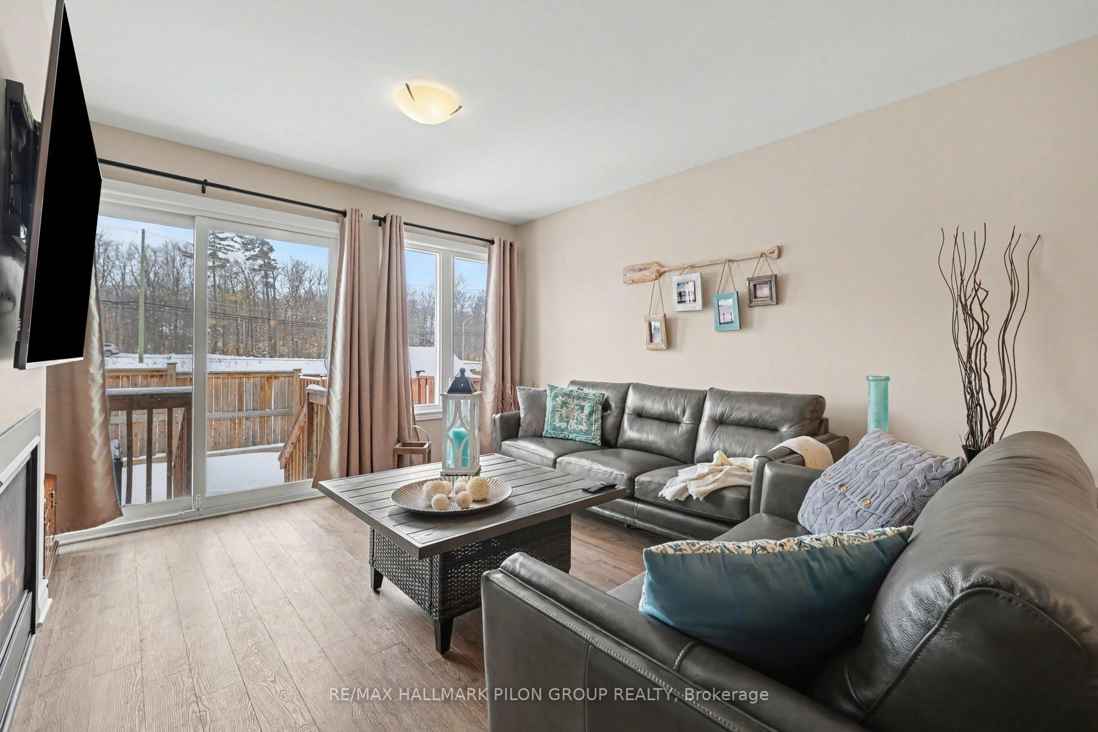 Living room with furniture, wood/laminate floor for 4 Morgan Clouthier Way, Arnprior Ontario K7S 0H9