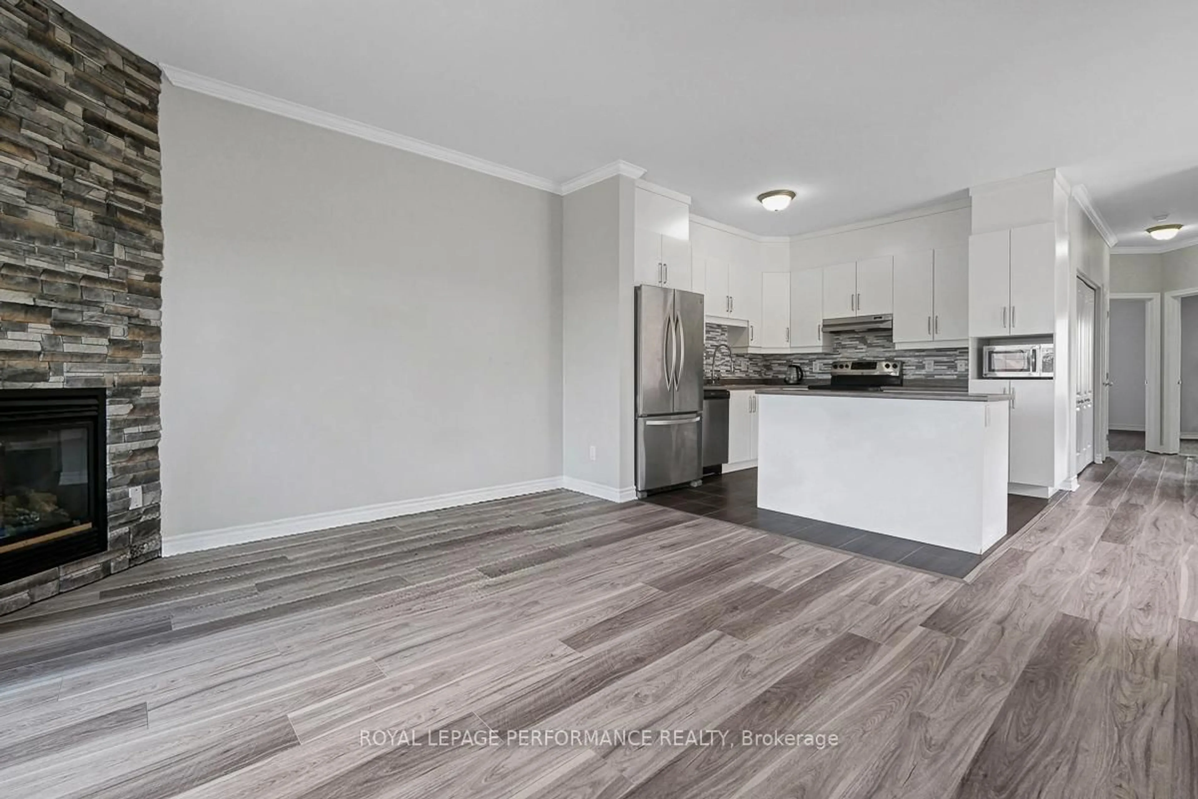 Open concept kitchen, wood/laminate floor for 181 Bourdeau Blvd #3, The Nation Ontario K0A 2M0