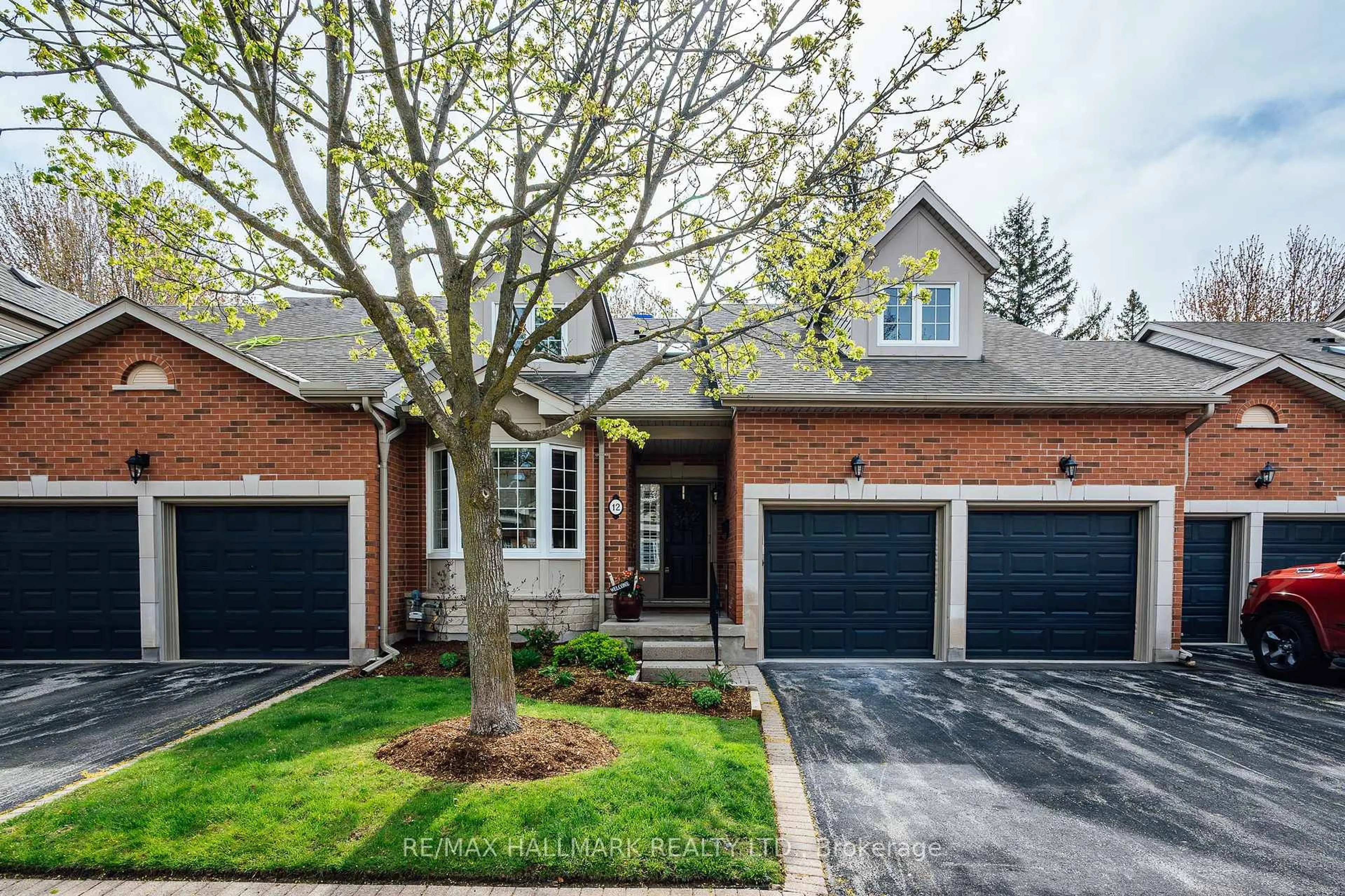 Home with brick exterior material, street for 12 Fairway Lane, Guelph Ontario N1E 7A9