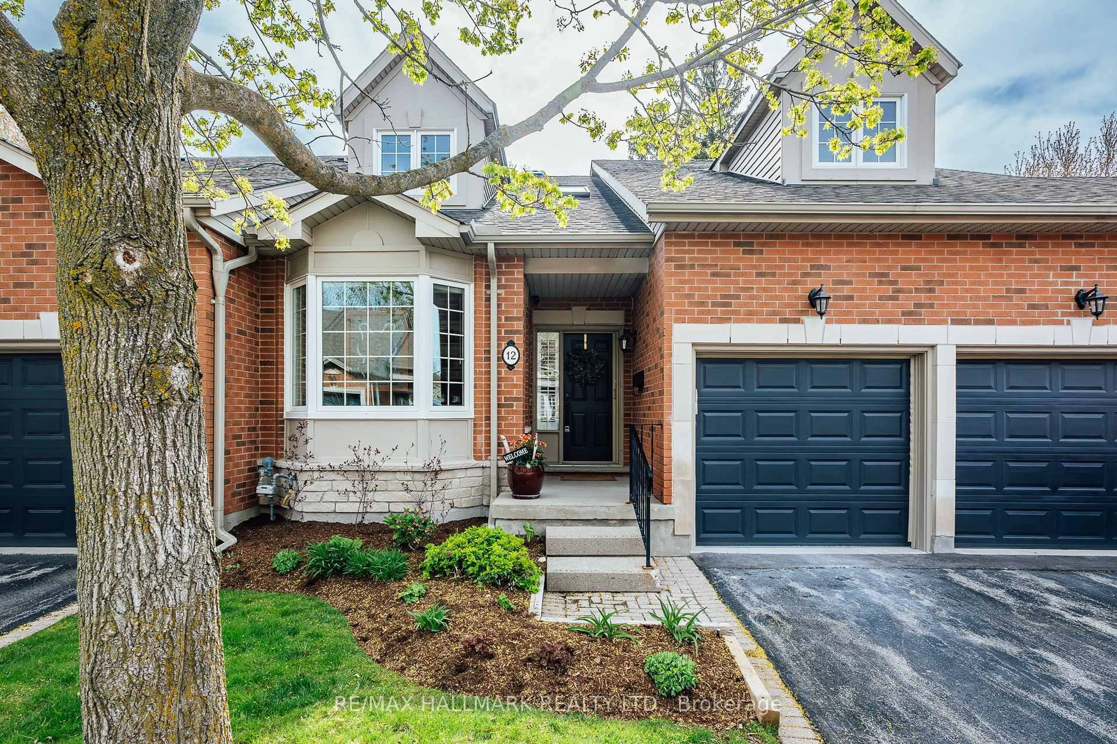Home with brick exterior material, street for 12 Fairway Lane, Guelph Ontario N1E 7A9