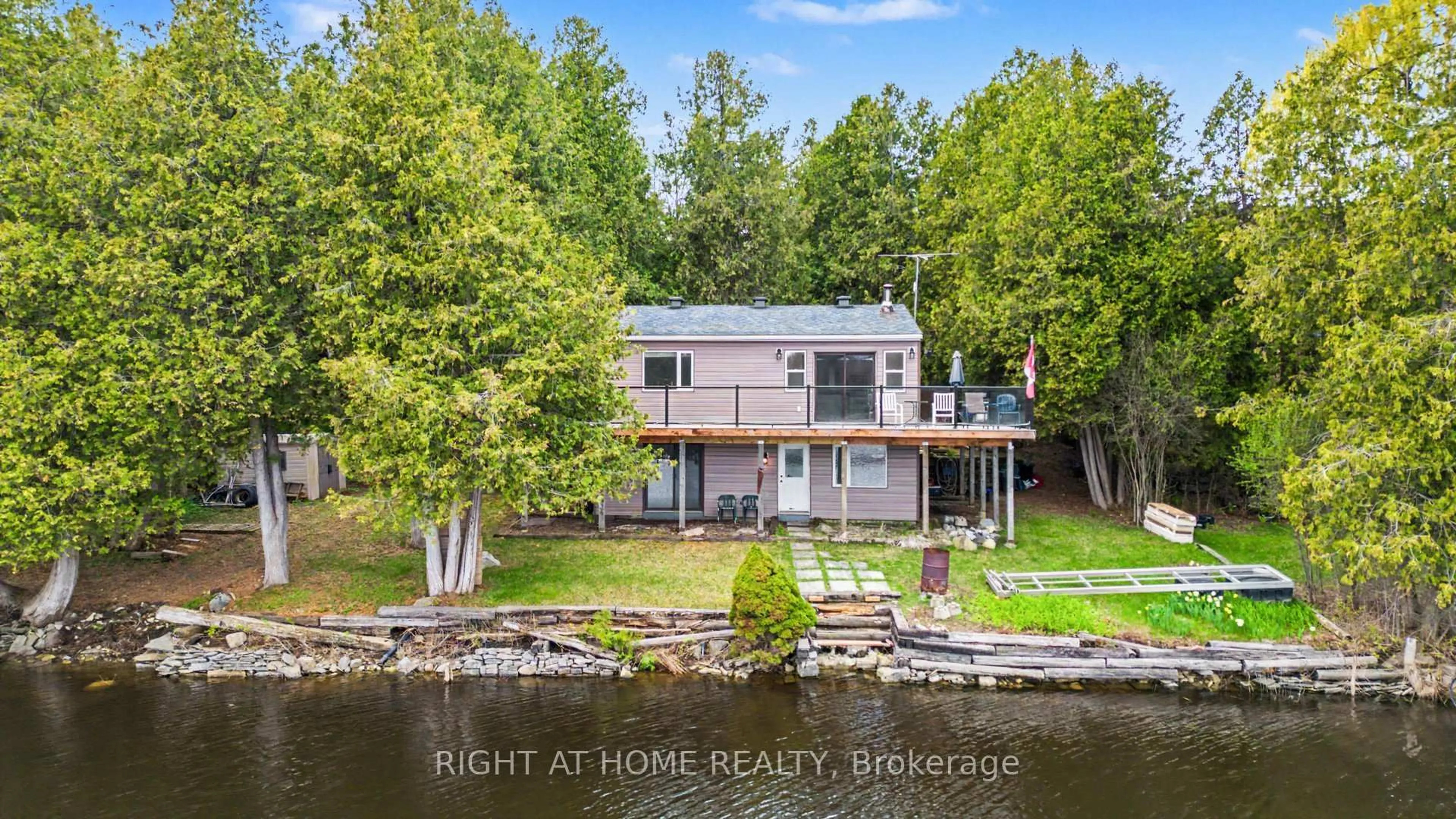 A pic from outside/outdoor area/front of a property/back of a property/a pic from drone, water/lake/river/ocean view for 4664 Northwoods Dr, Ottawa Ontario K0A 3M0