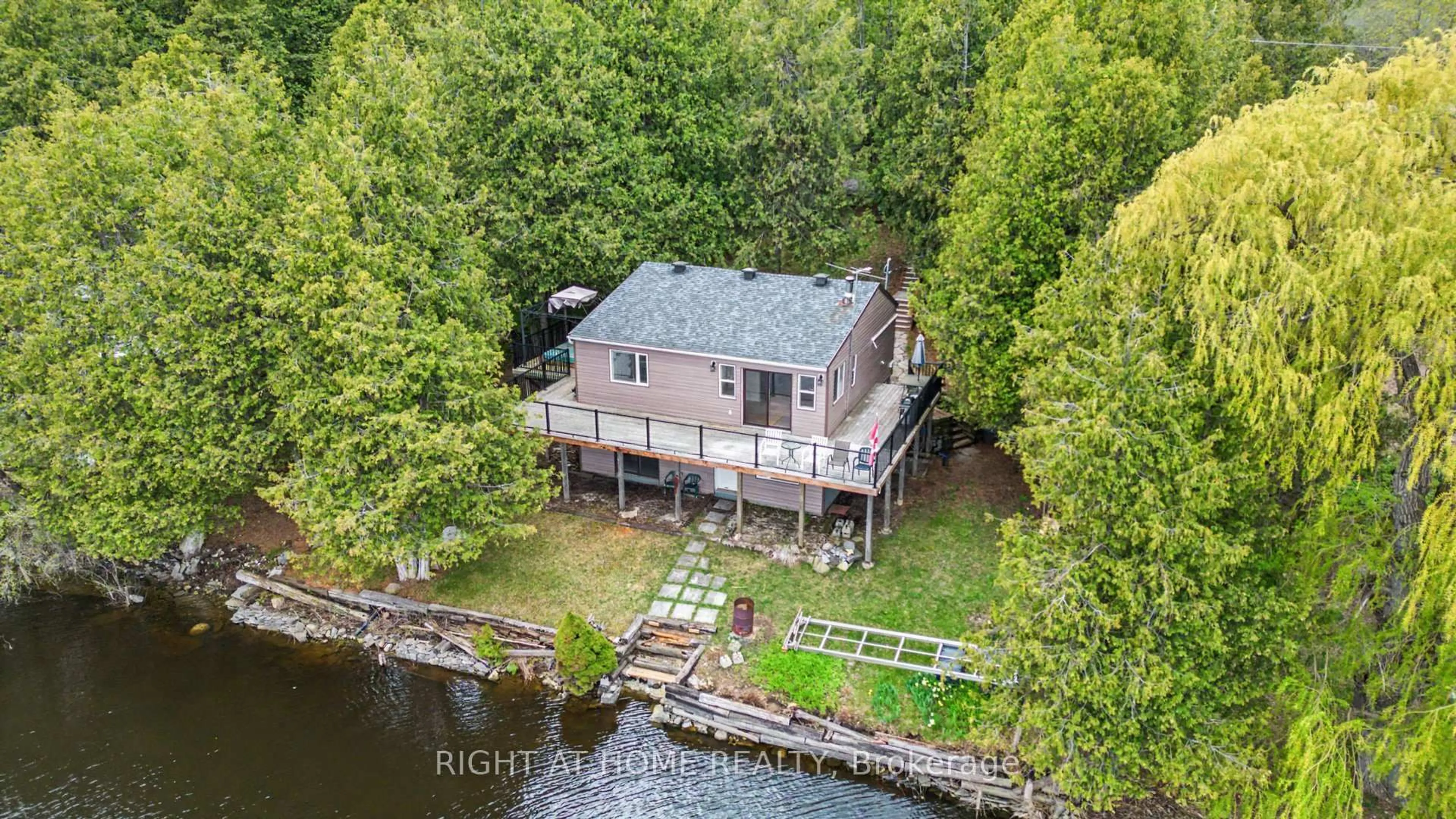 A pic from outside/outdoor area/front of a property/back of a property/a pic from drone, water/lake/river/ocean view for 4664 Northwoods Dr, Ottawa Ontario K0A 3M0