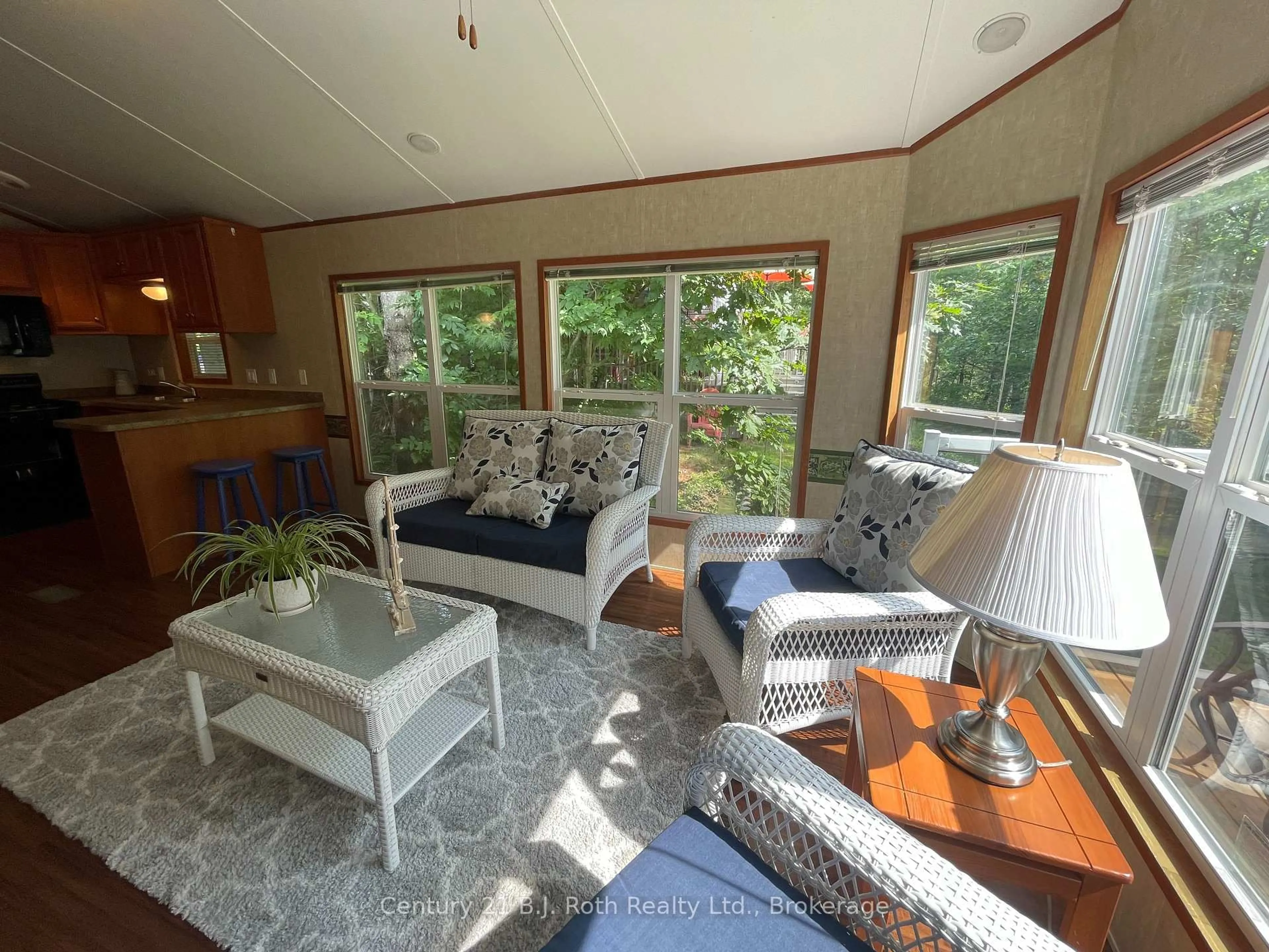 Living room with furniture, wood/laminate floor for 1336 SOUTH MORRISON LAKE Rd #3 Morrison Creek, Gravenhurst Ontario P0E 1G0
