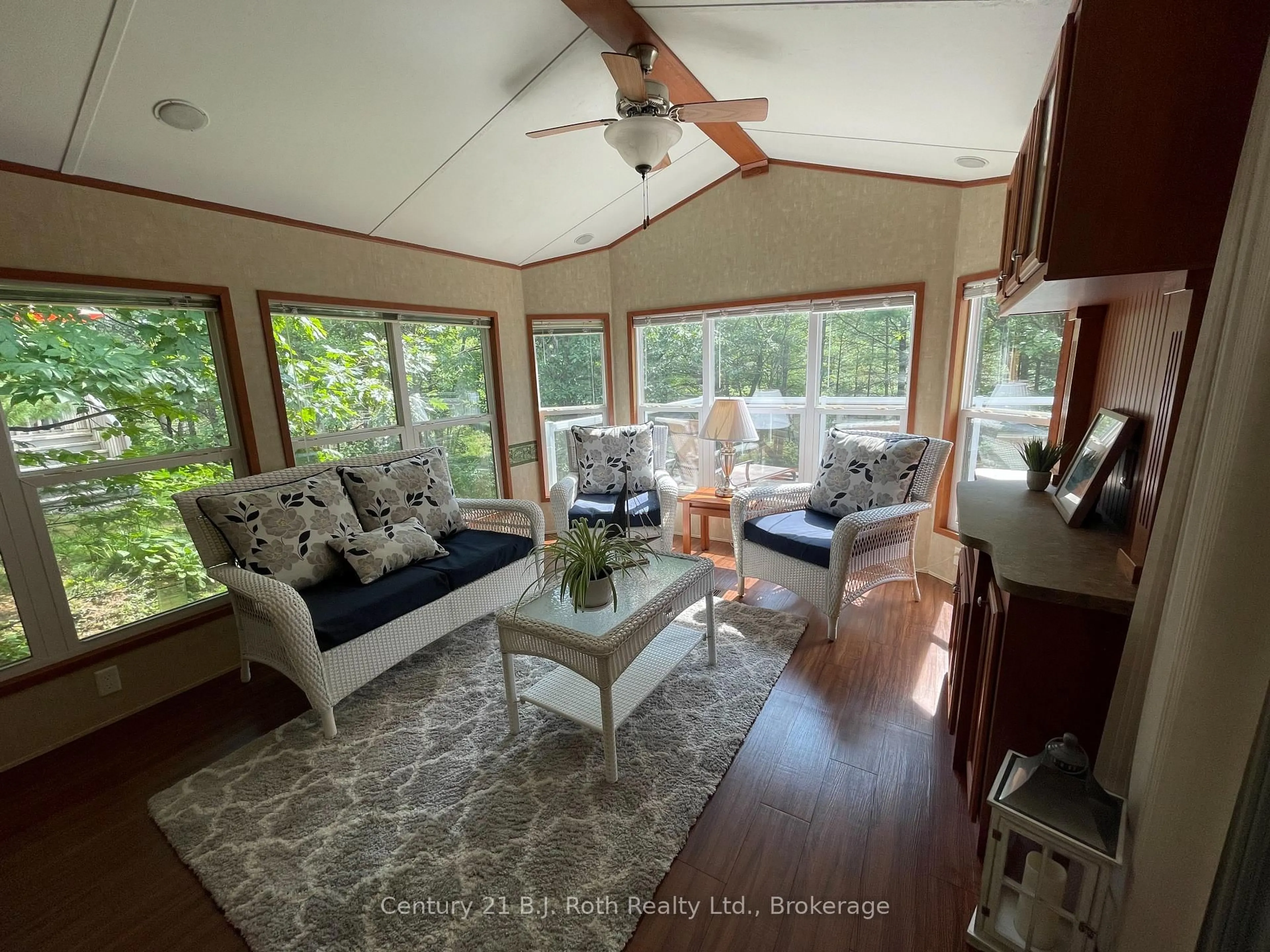 Living room with furniture, wood/laminate floor for 1336 SOUTH MORRISON LAKE Rd #3 Morrison Creek, Gravenhurst Ontario P0E 1G0