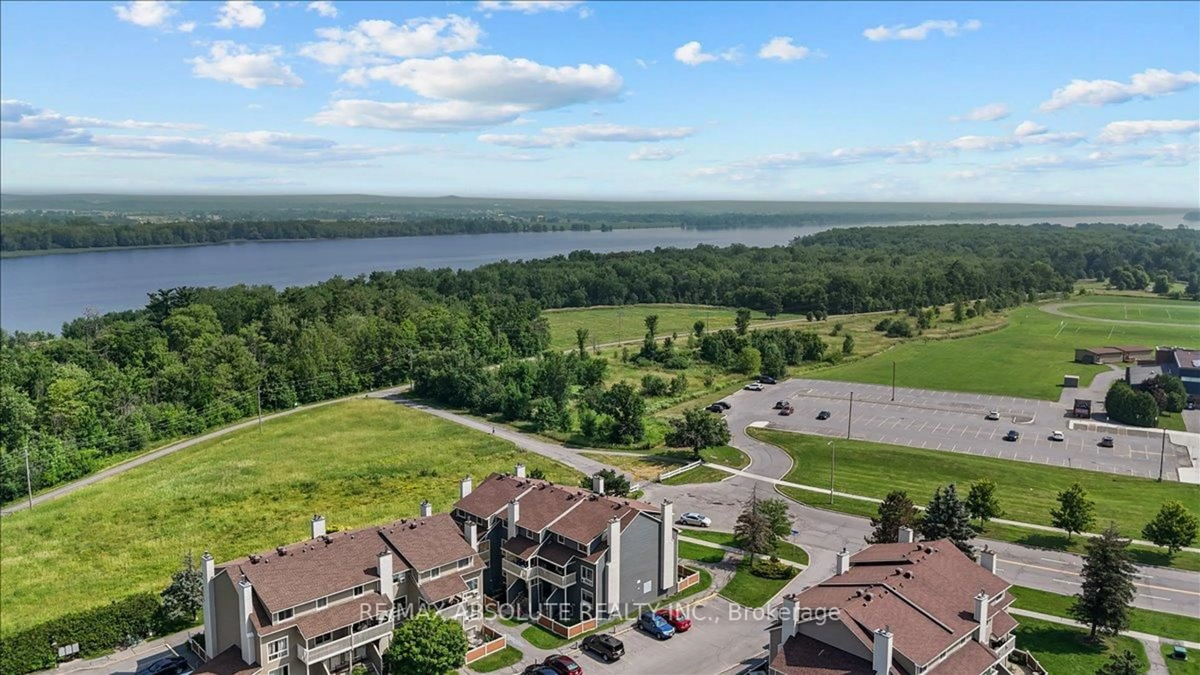 A pic from outside/outdoor area/front of a property/back of a property/a pic from drone, water/lake/river/ocean view for 762 St. Andre Dr #5B, Ottawa Ontario K1C 4S7