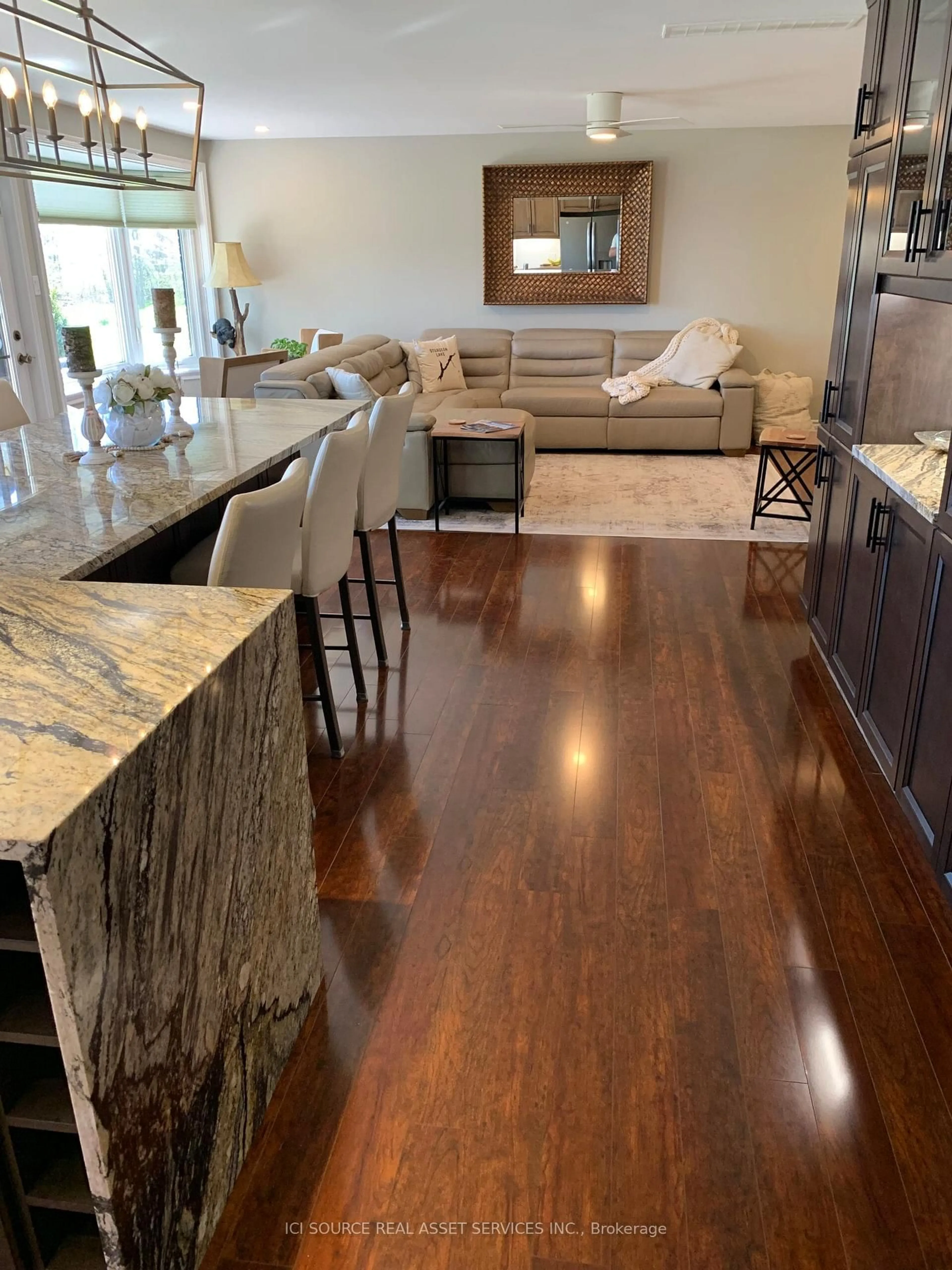 Open concept kitchen, wood/laminate floor for 200 East St #211, Kawartha Lakes Ontario K0M 1A0
