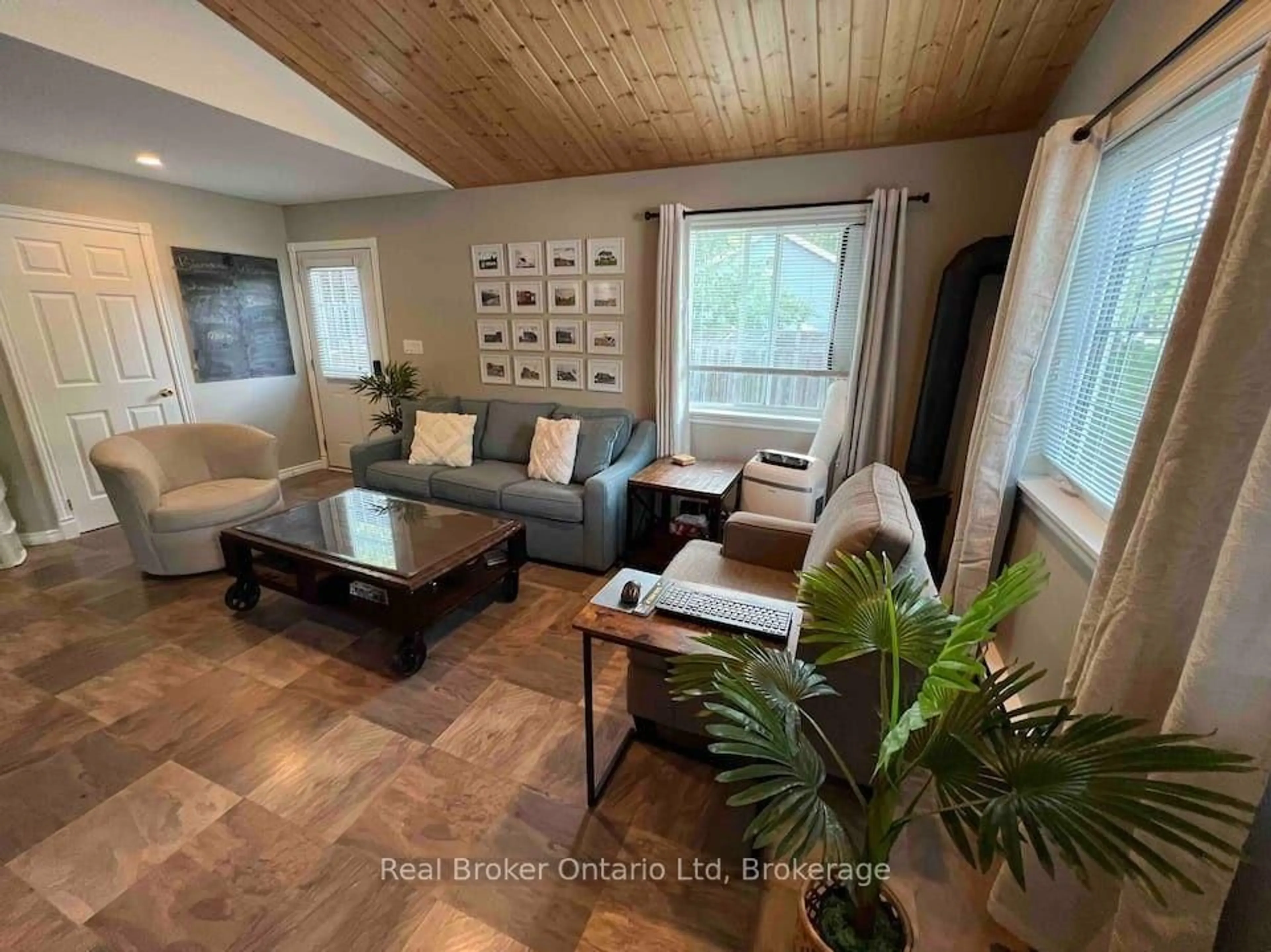 Living room with furniture, wood/laminate floor for 208 Second Ave, South Bruce Peninsula Ontario N0H 2G0