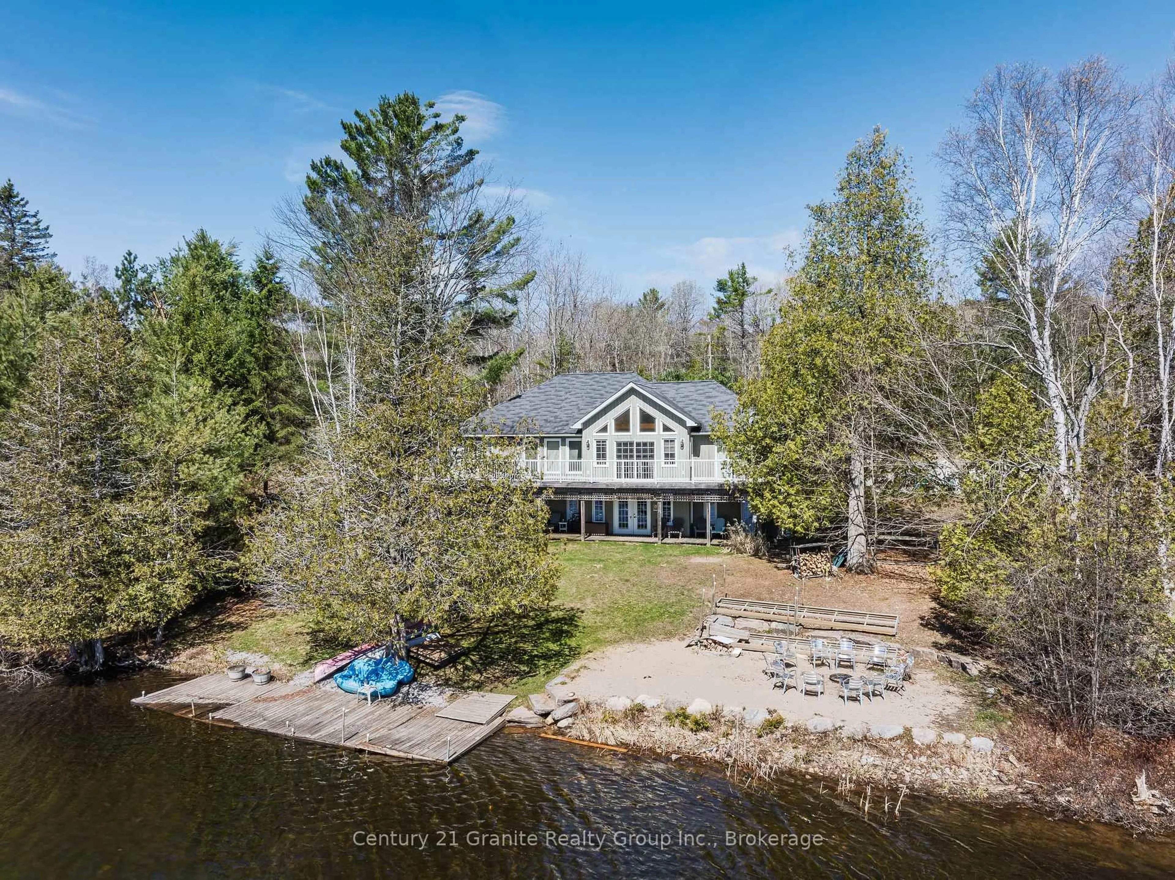 A pic from outside/outdoor area/front of a property/back of a property/a pic from drone, water/lake/river/ocean view for 15190 Highway 118, Dysart et al Ontario K0M 1S0