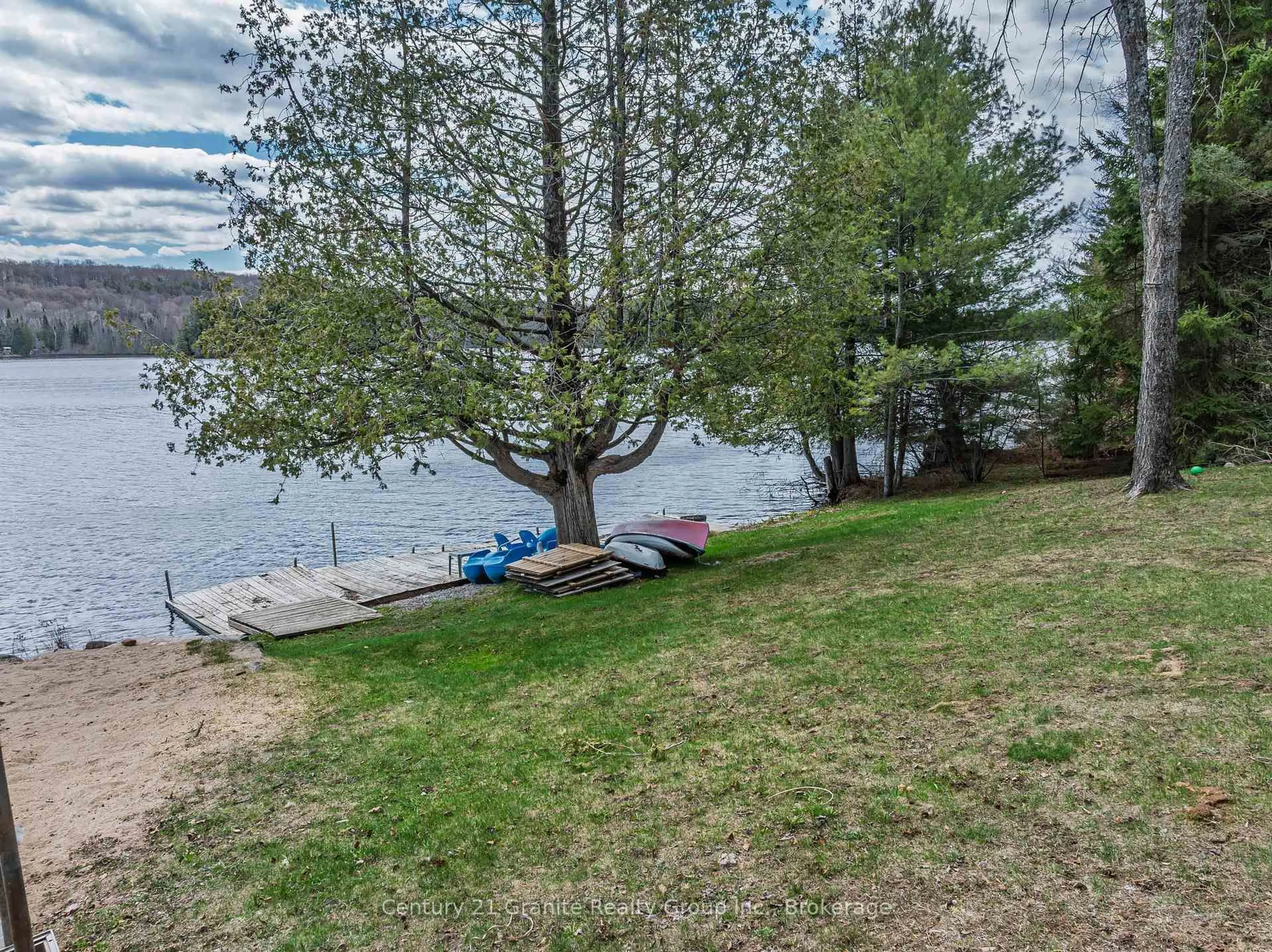 A pic from outside/outdoor area/front of a property/back of a property/a pic from drone, water/lake/river/ocean view for 15190 Highway 118, Dysart et al Ontario K0M 1S0