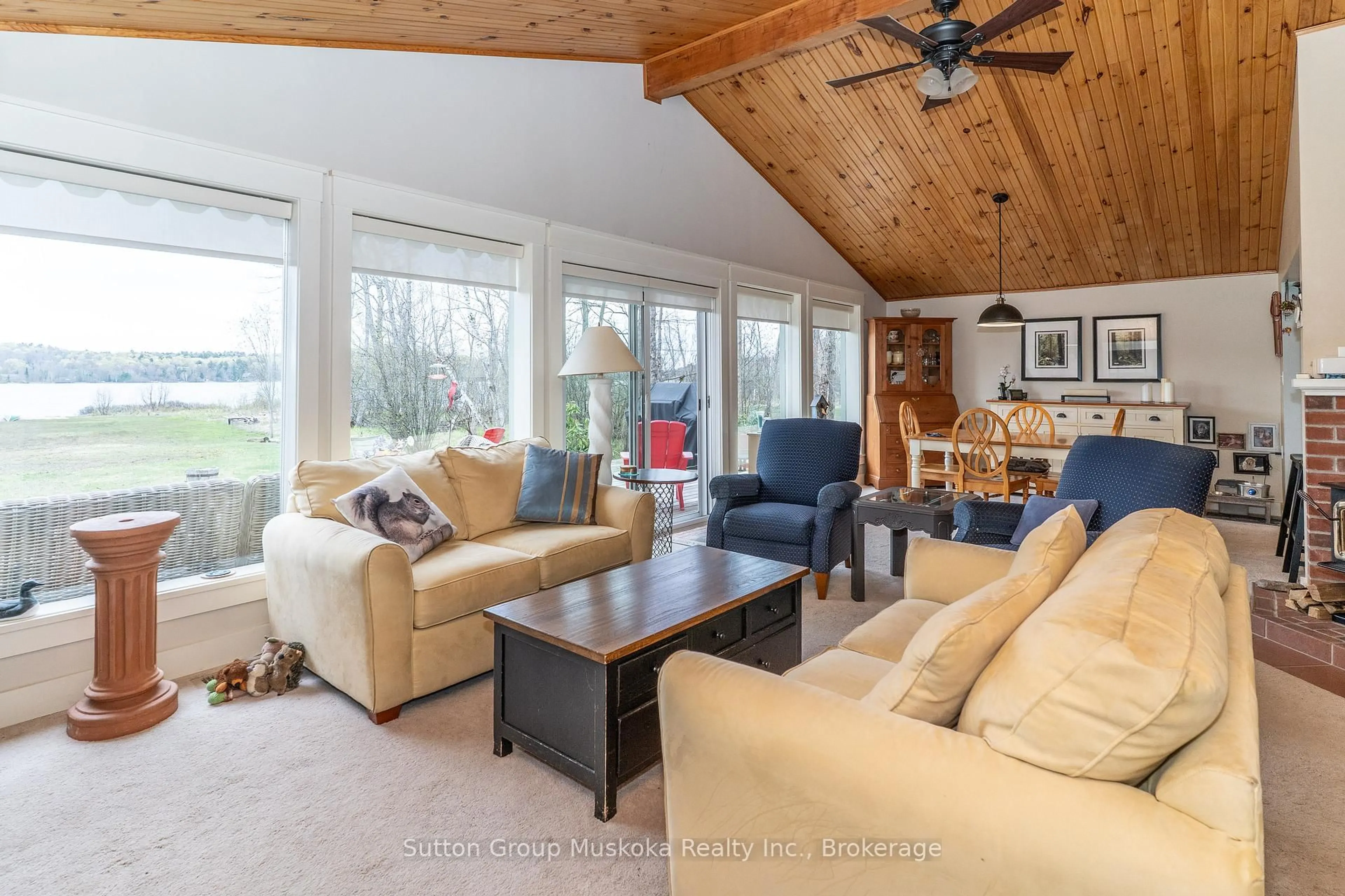 Living room with furniture, wood/laminate floor for 435 North Deer Lake Rd, Huntsville Ontario P0B 1L0