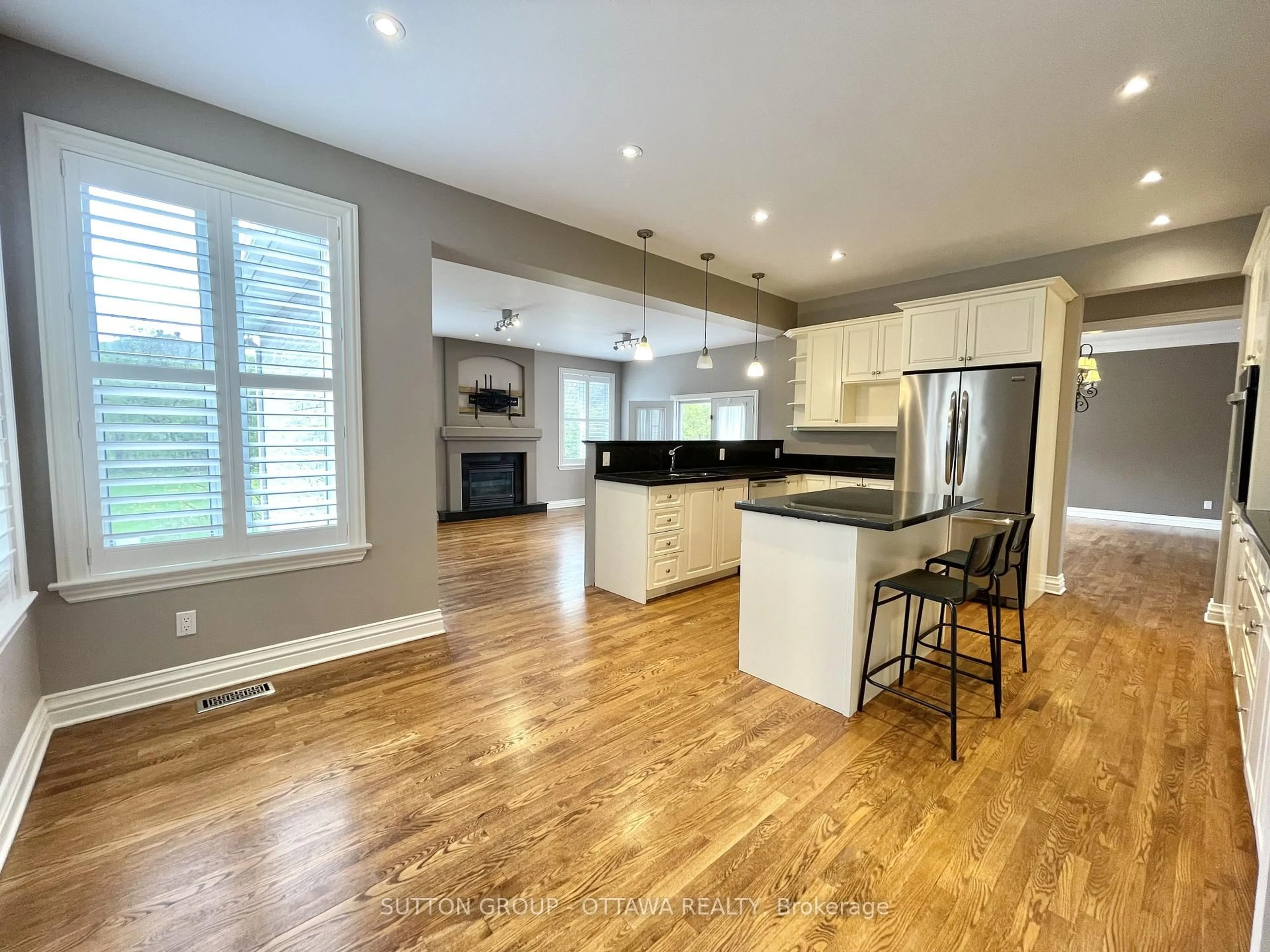 Open concept kitchen, wood/laminate floor for 1520 Arnhem St, Ottawa Ontario K2C 1V1