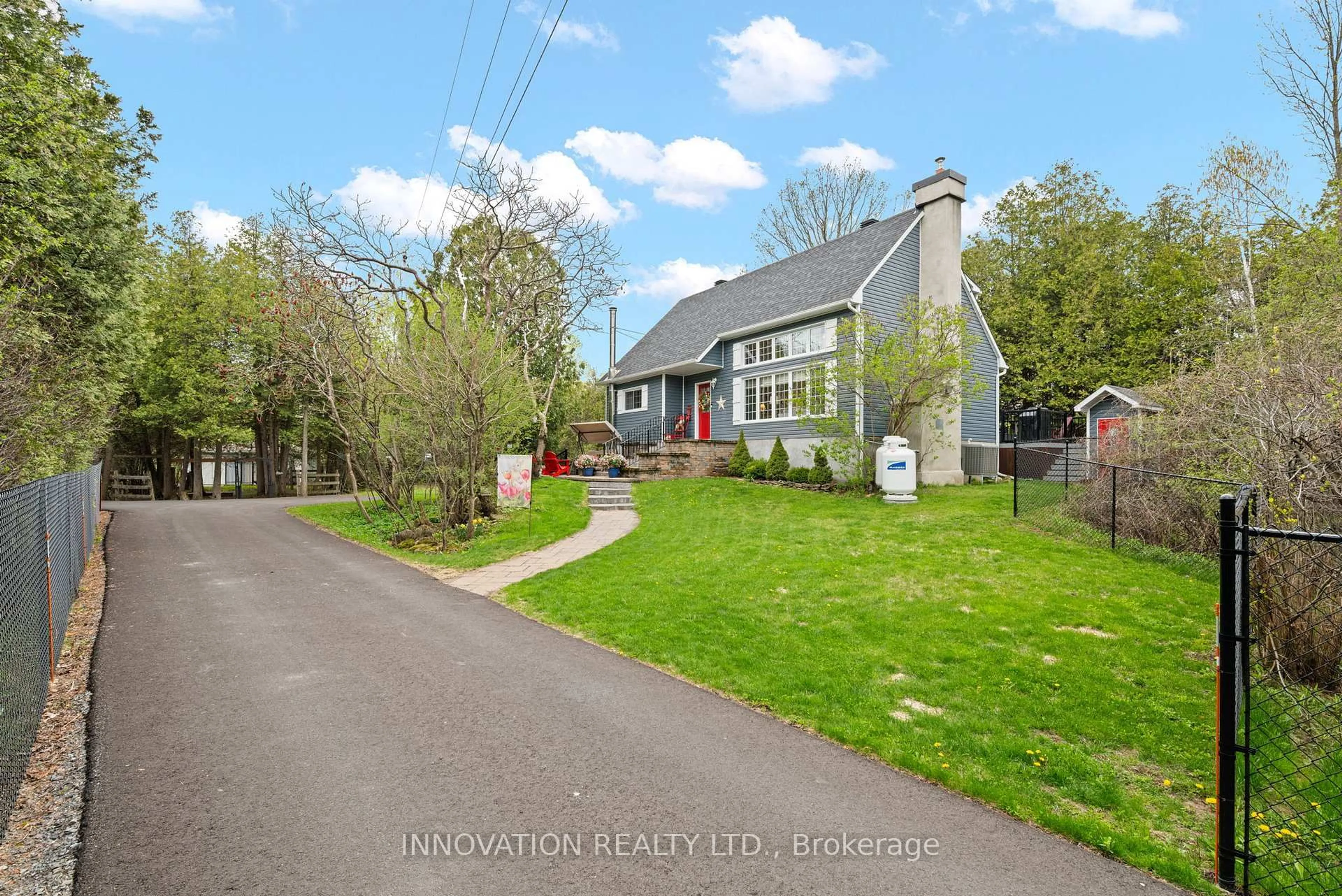 A pic from outside/outdoor area/front of a property/back of a property/a pic from drone, street for 208 Davis Rd, North Grenville Ontario K0G 1N0