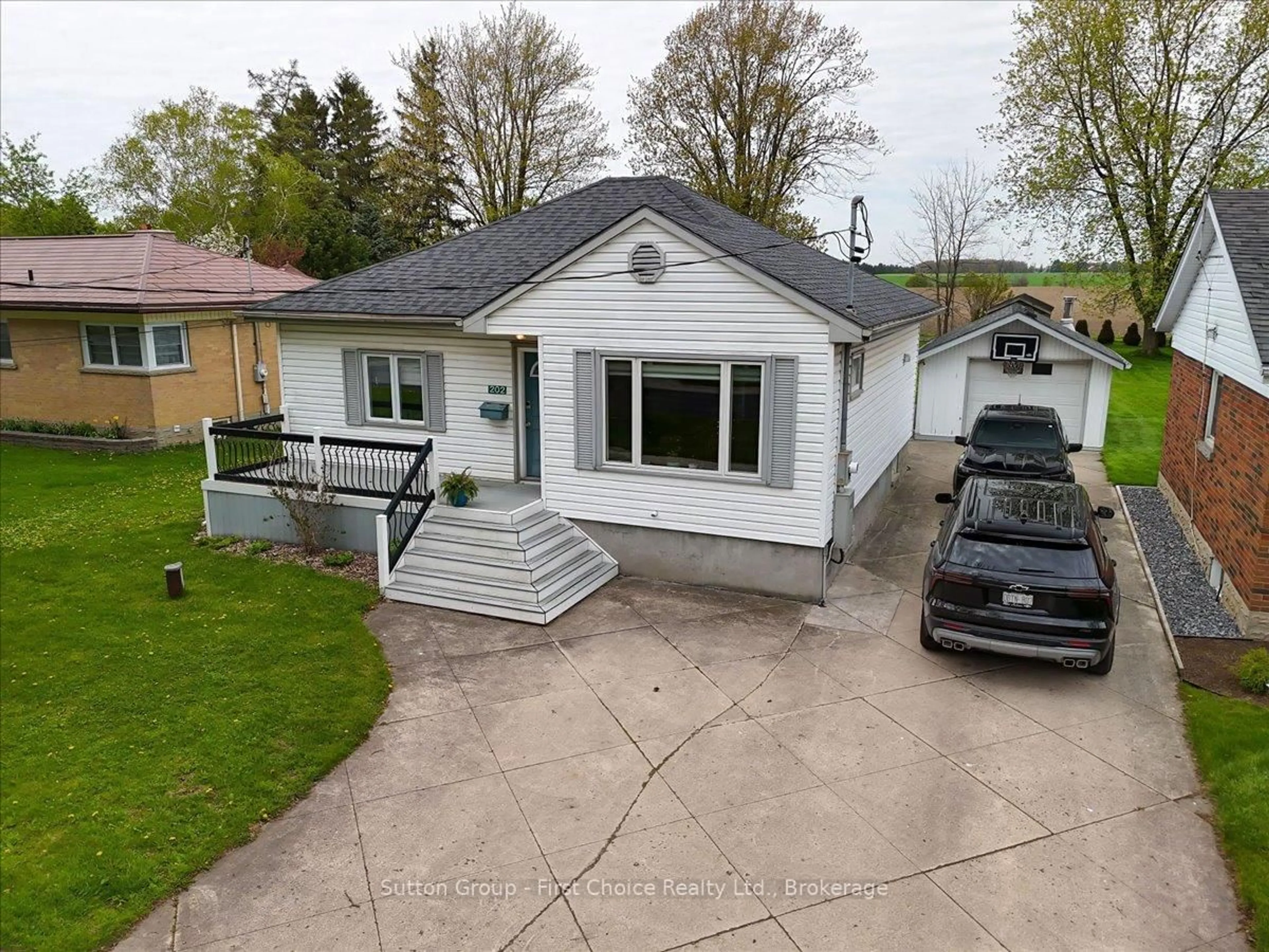 A pic from outside/outdoor area/front of a property/back of a property/a pic from drone, street for 202 Huron Rd, Perth South Ontario N0K 1X0