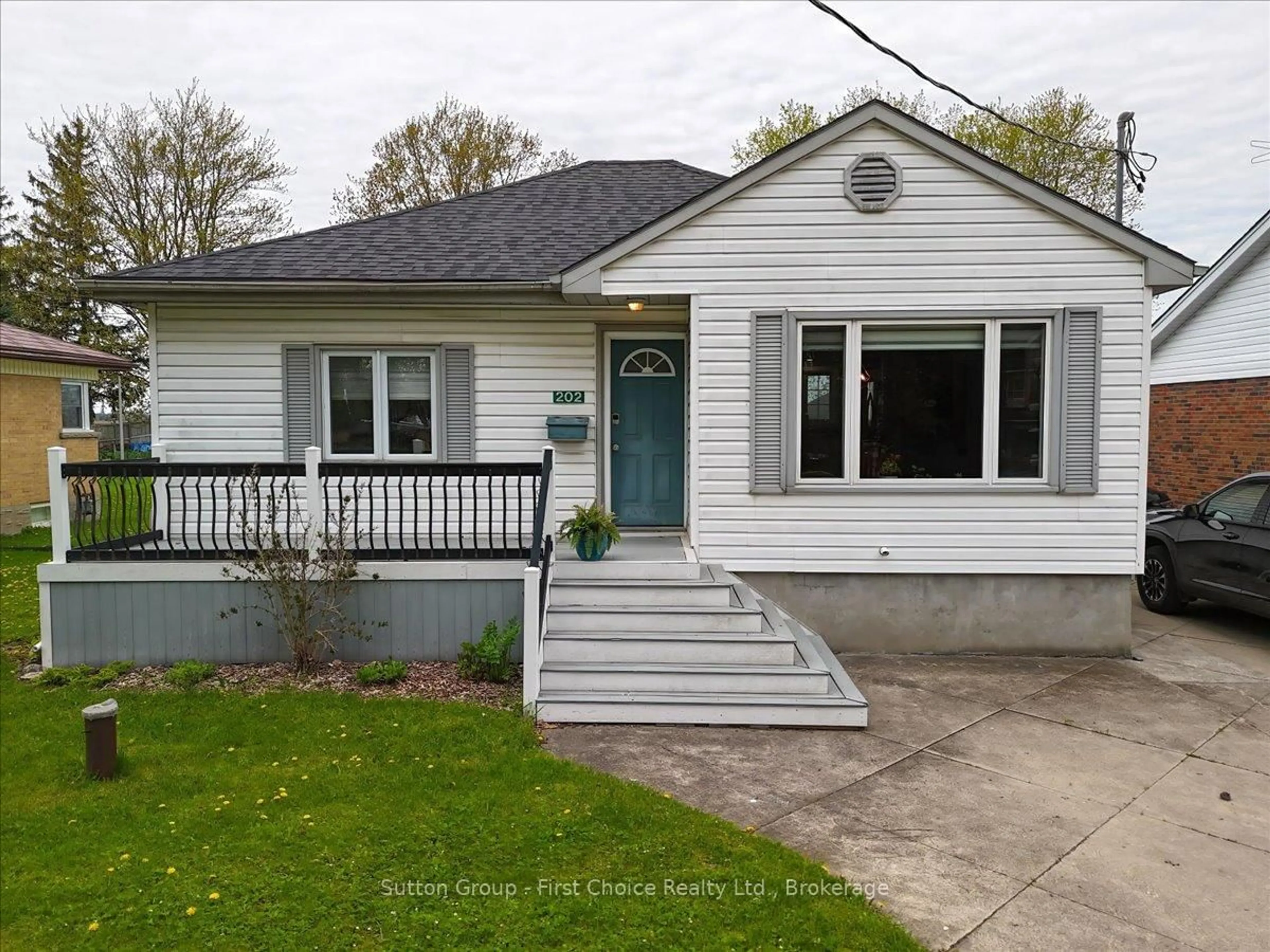 Home with vinyl exterior material, street for 202 Huron Rd, Perth South Ontario N0K 1X0
