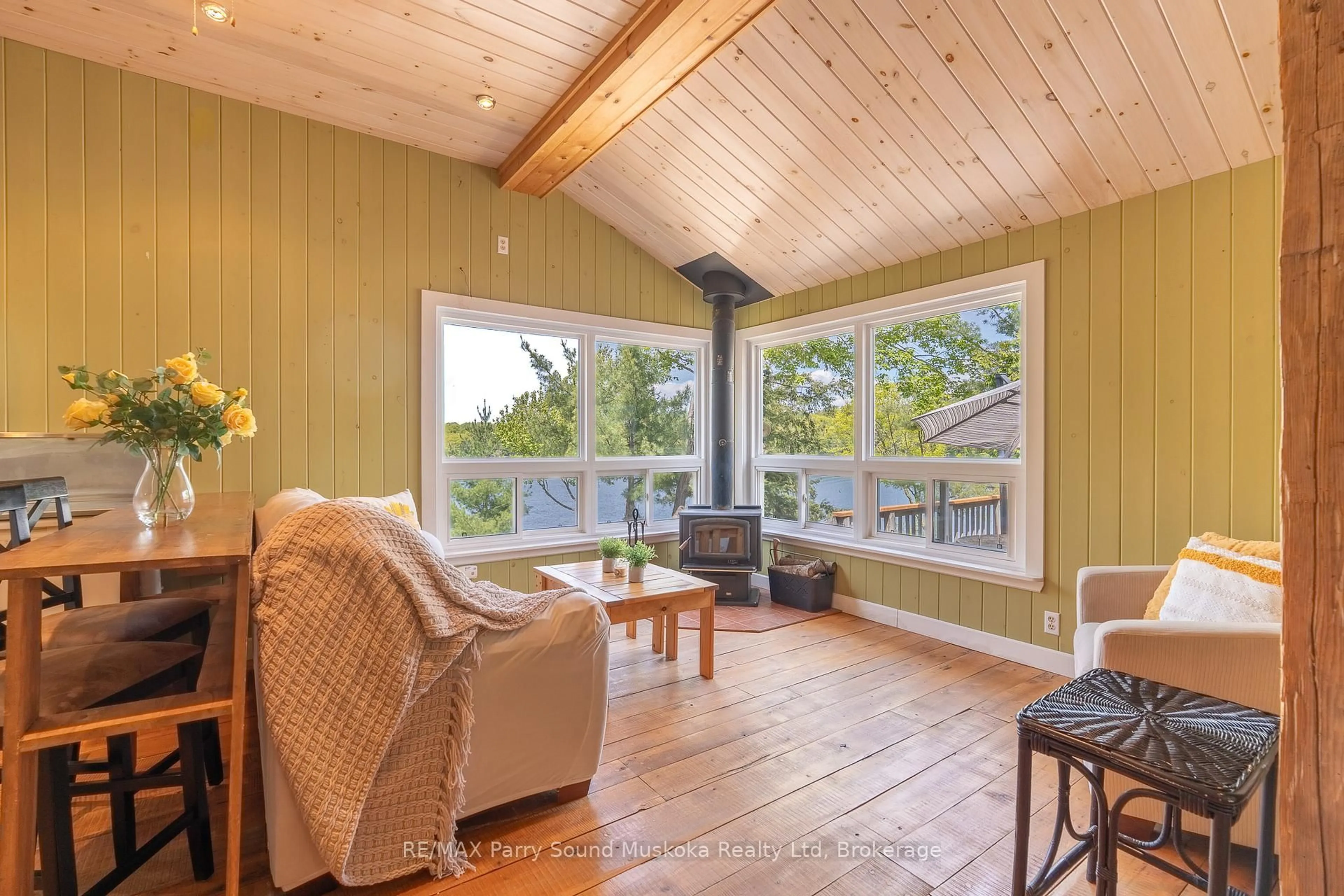 Living room with furniture, wood/laminate floor for 7 Isabella Island, The Archipelago Ontario P2A 2W8