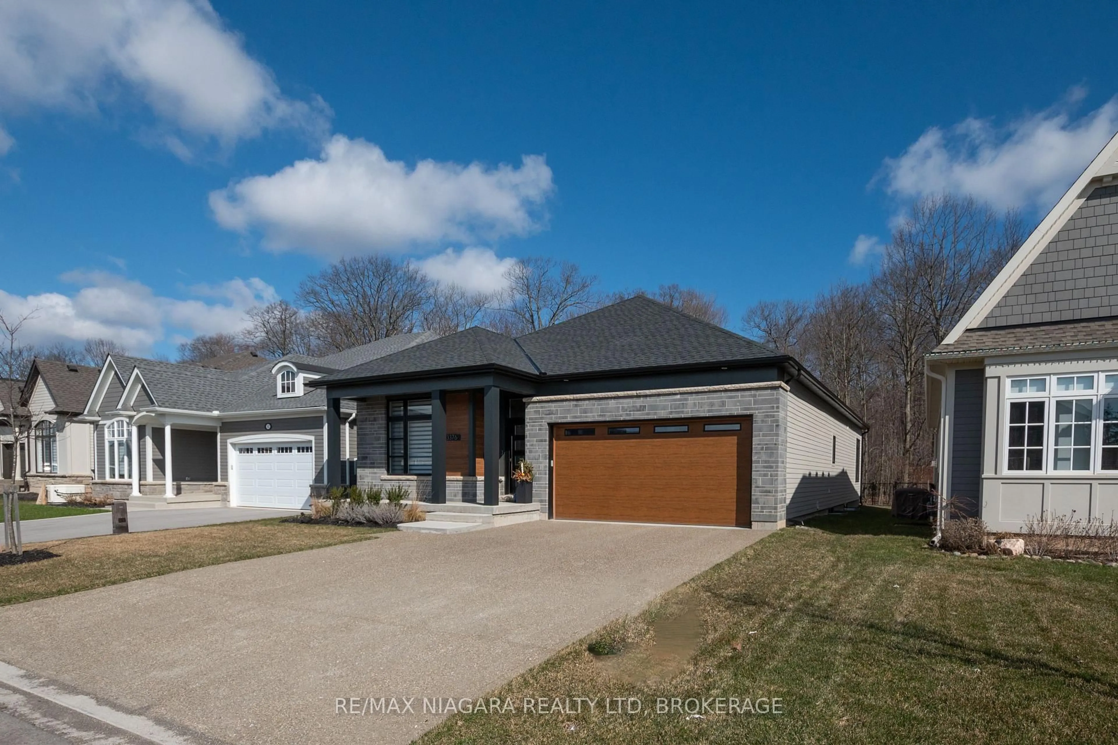 Home with brick exterior material, street for 3376 Whispering Woods Tr, Fort Erie Ontario L0S 1N0
