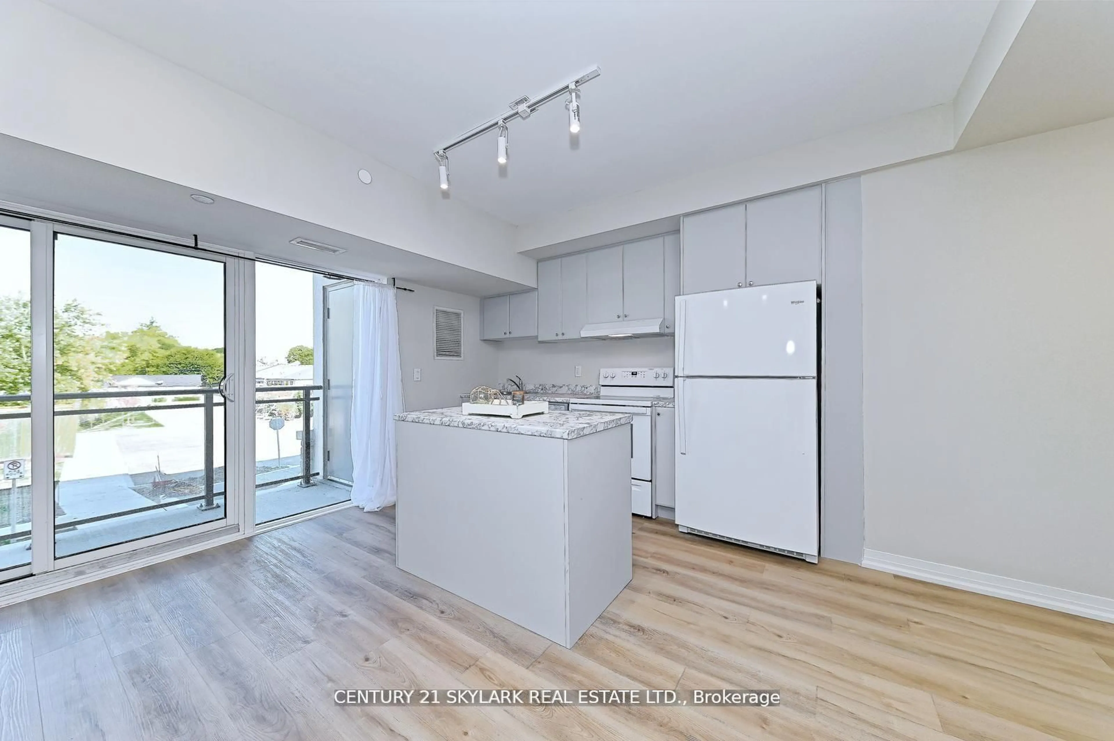 Open concept kitchen, wood/laminate floor for 50 Herrick Ave Ave #216, St. Catharines Ontario L2P 2W7