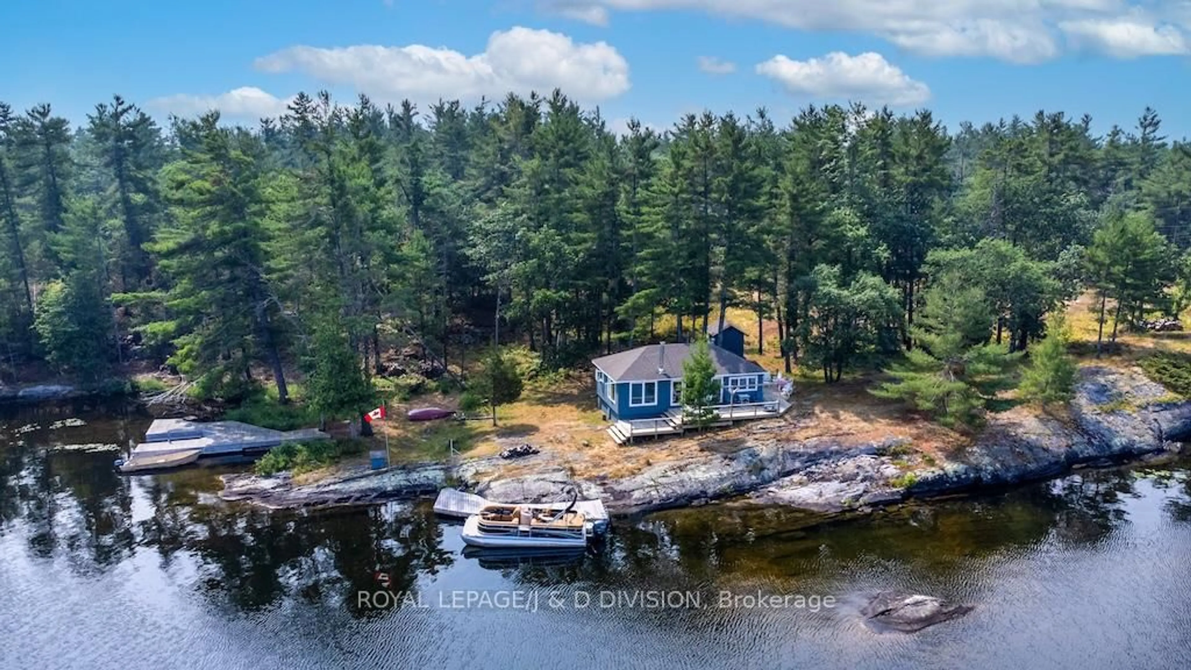 A pic from outside/outdoor area/front of a property/back of a property/a pic from drone, water/lake/river/ocean view for 4446 Is 107 Stoney Lake Island, North Kawartha Ontario K0L 2H0