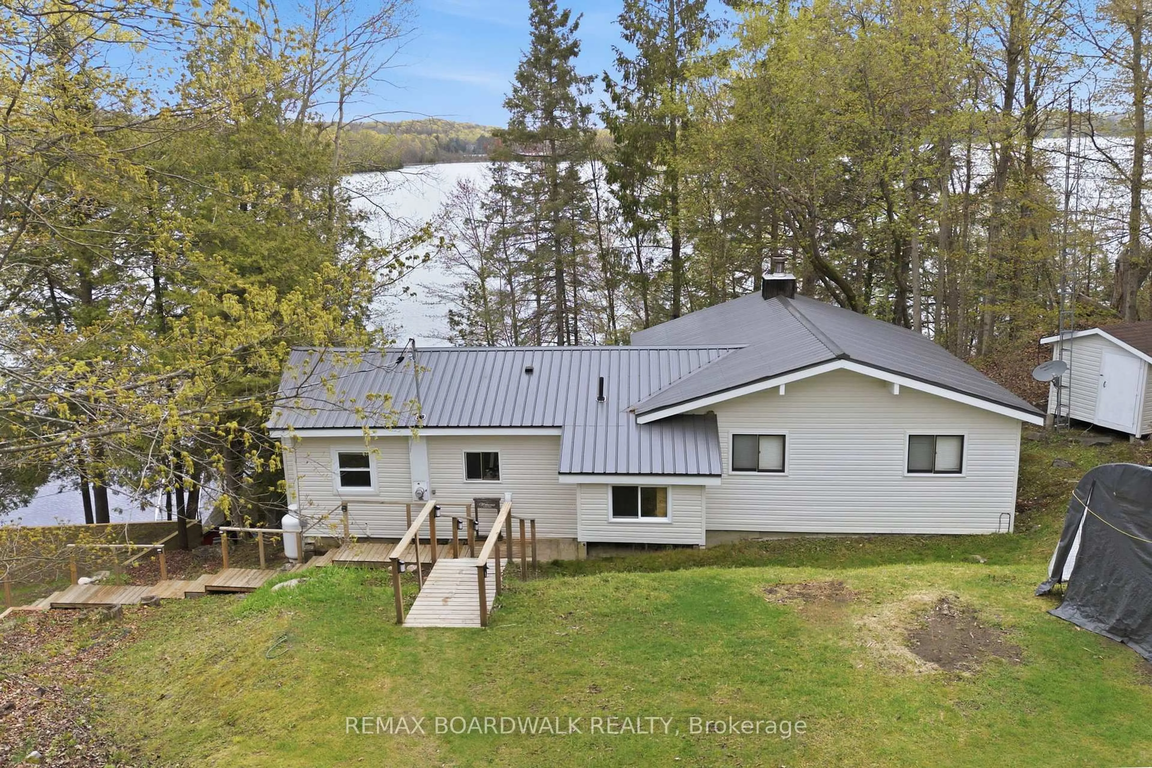 A pic from outside/outdoor area/front of a property/back of a property/a pic from drone, unknown for 1091 Big Clear Lane, Frontenac Ontario K0H 0B6