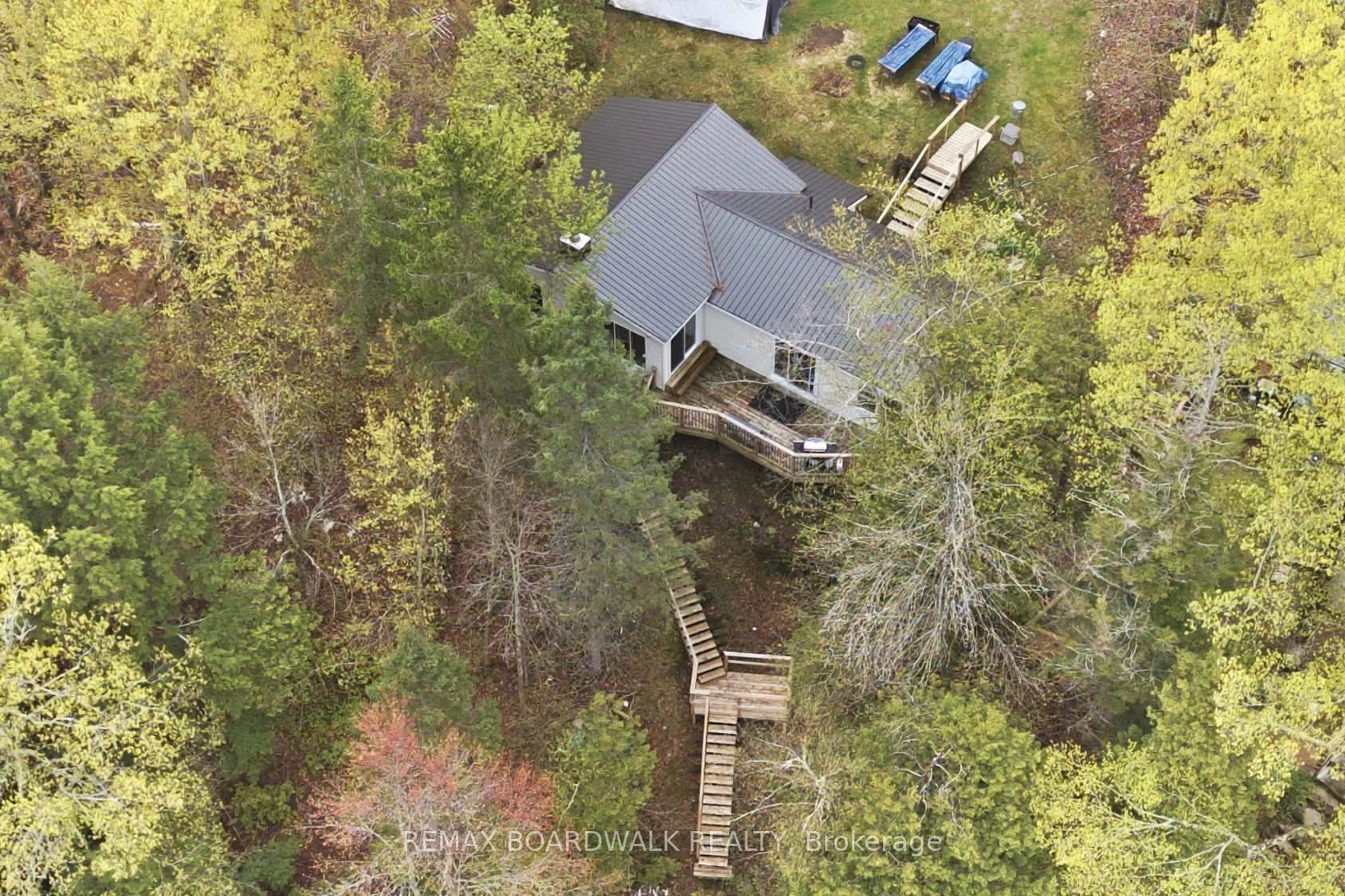 A pic from outside/outdoor area/front of a property/back of a property/a pic from drone, water/lake/river/ocean view for 1091 Big Clear Lane, Frontenac Ontario K0H 0B6
