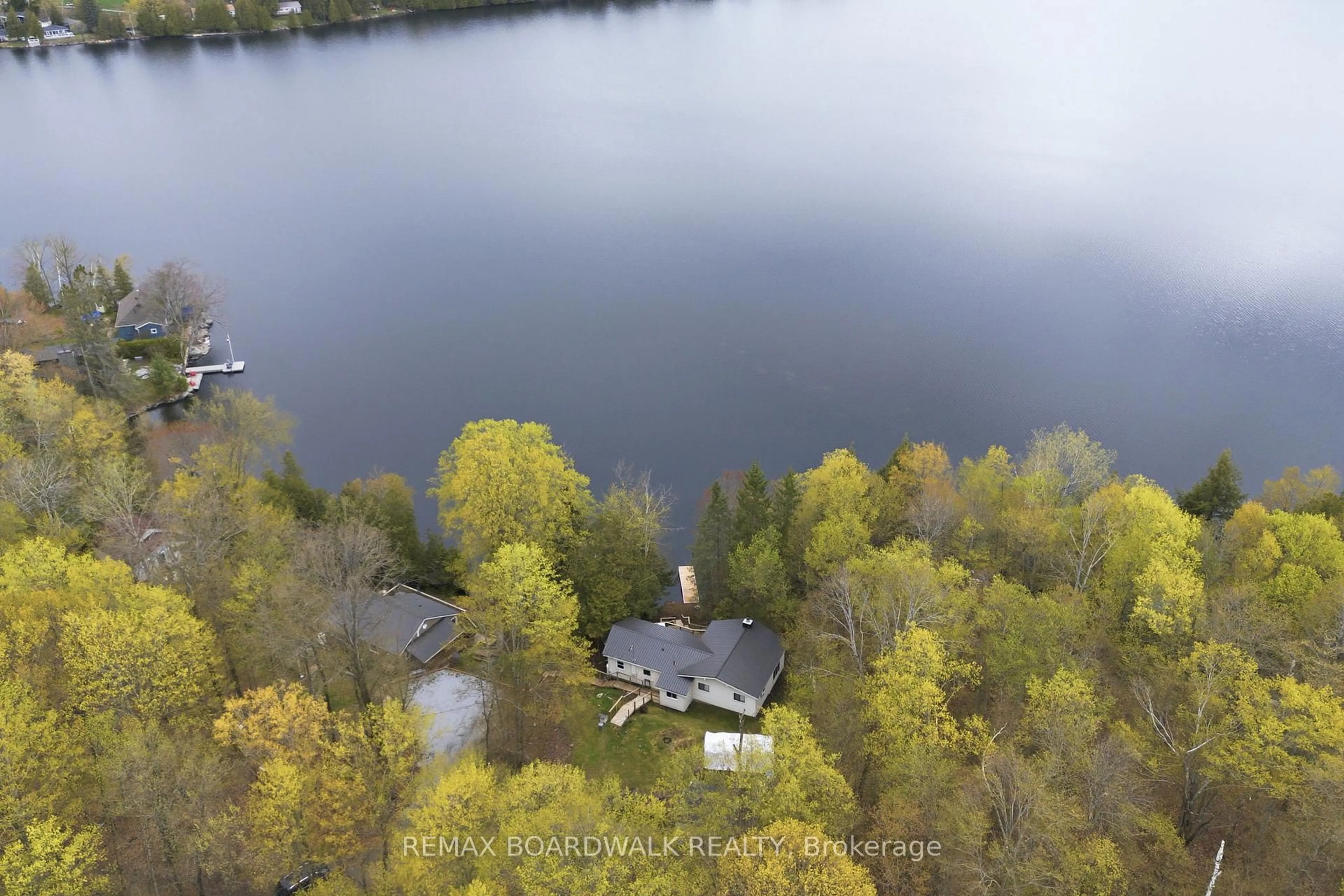 A pic from outside/outdoor area/front of a property/back of a property/a pic from drone, water/lake/river/ocean view for 1091 Big Clear Lane, Frontenac Ontario K0H 0B6