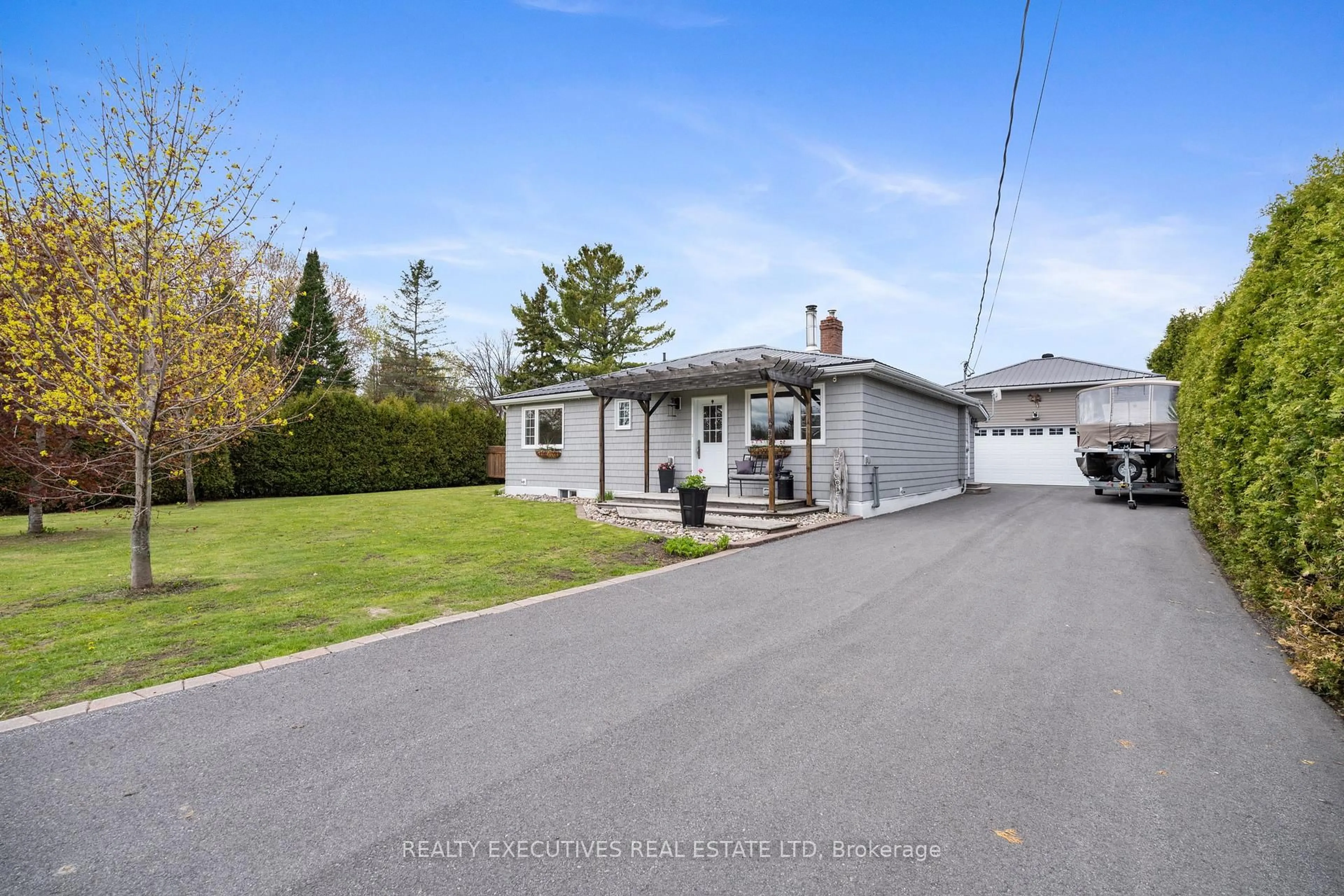 A pic from outside/outdoor area/front of a property/back of a property/a pic from drone, street for 13035 Riverside Dr, South Dundas Ontario K0C 1X0