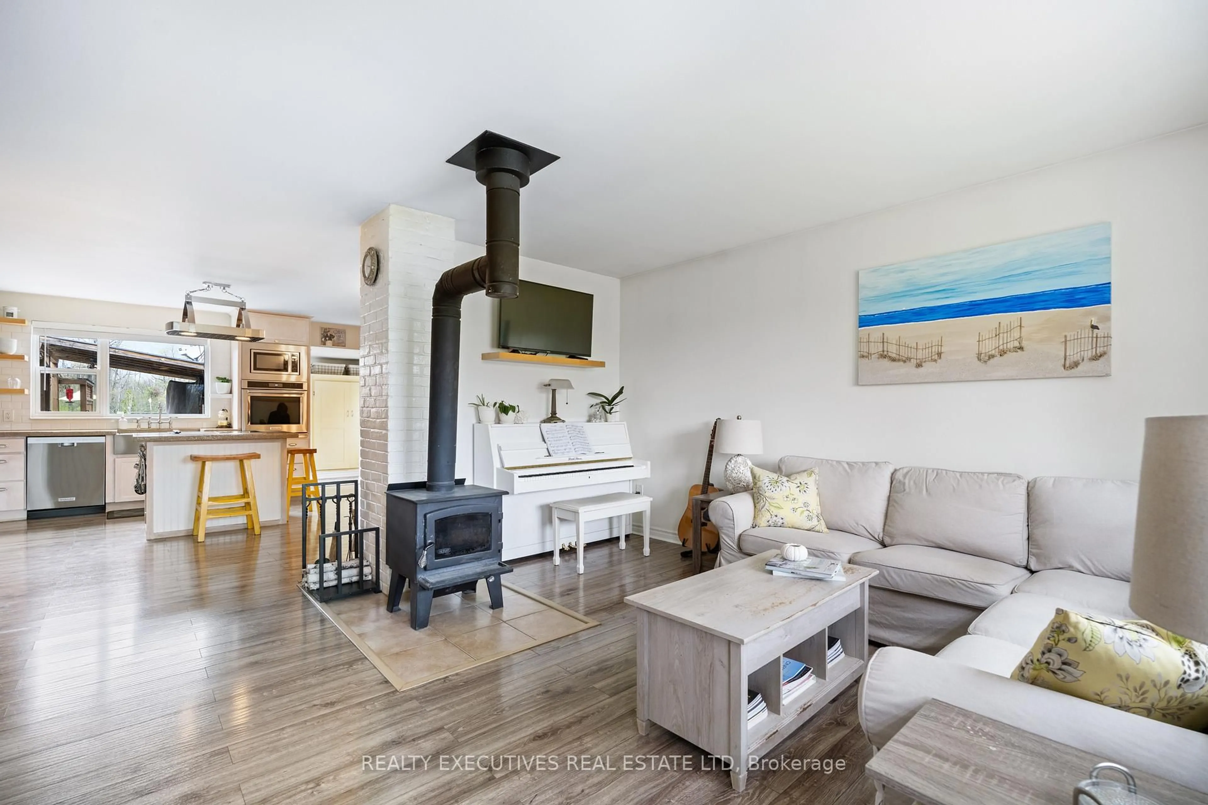 Living room with furniture, wood/laminate floor for 13035 Riverside Dr, South Dundas Ontario K0C 1X0