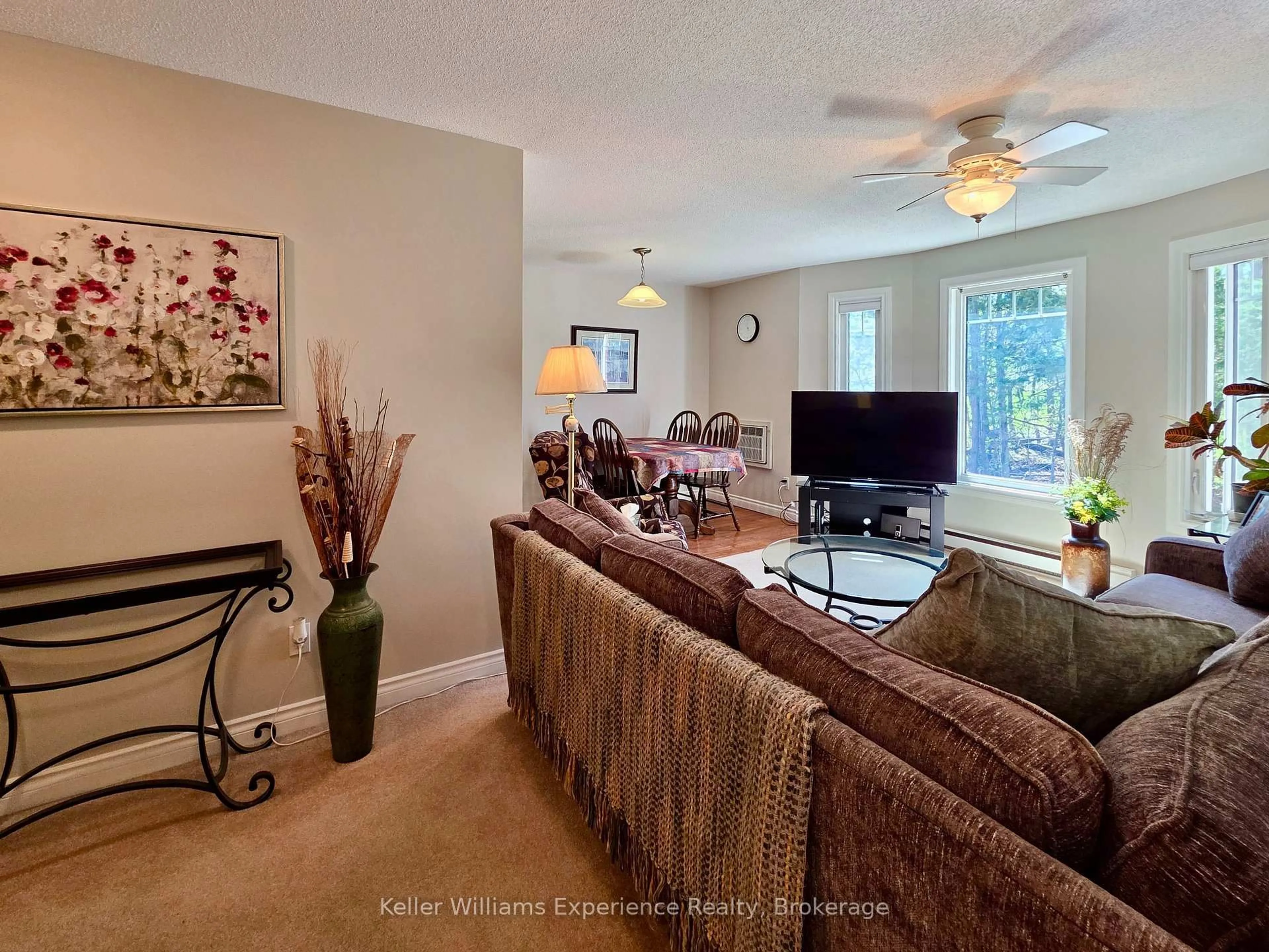 Living room with furniture, carpet floor for 657 Cedar Lane #202A, Bracebridge Ontario P1L 1P1