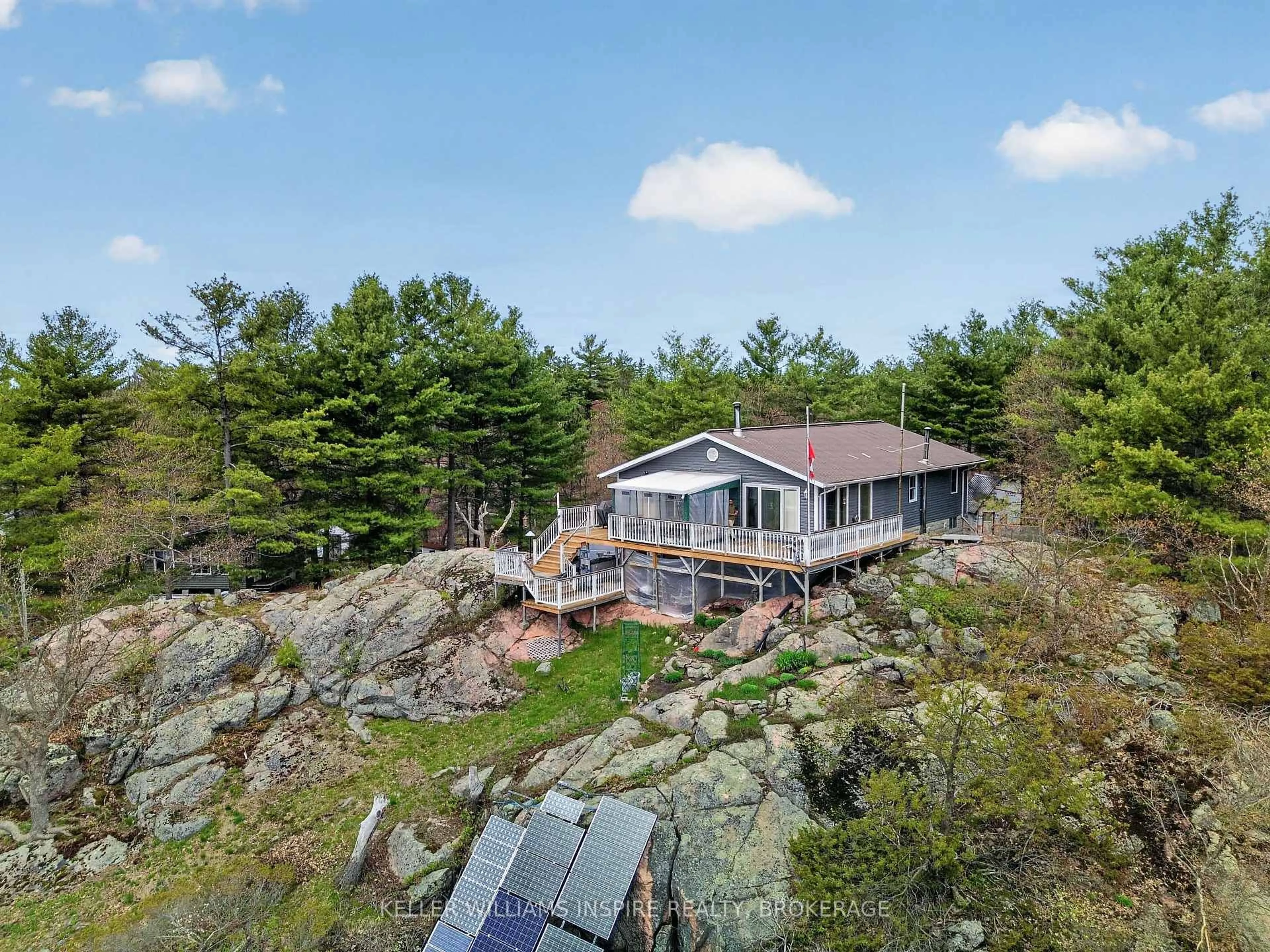 A pic from outside/outdoor area/front of a property/back of a property/a pic from drone, water/lake/river/ocean view for 2526 Sheffield Long Lake, Stone Mills Ontario K0K 1W0