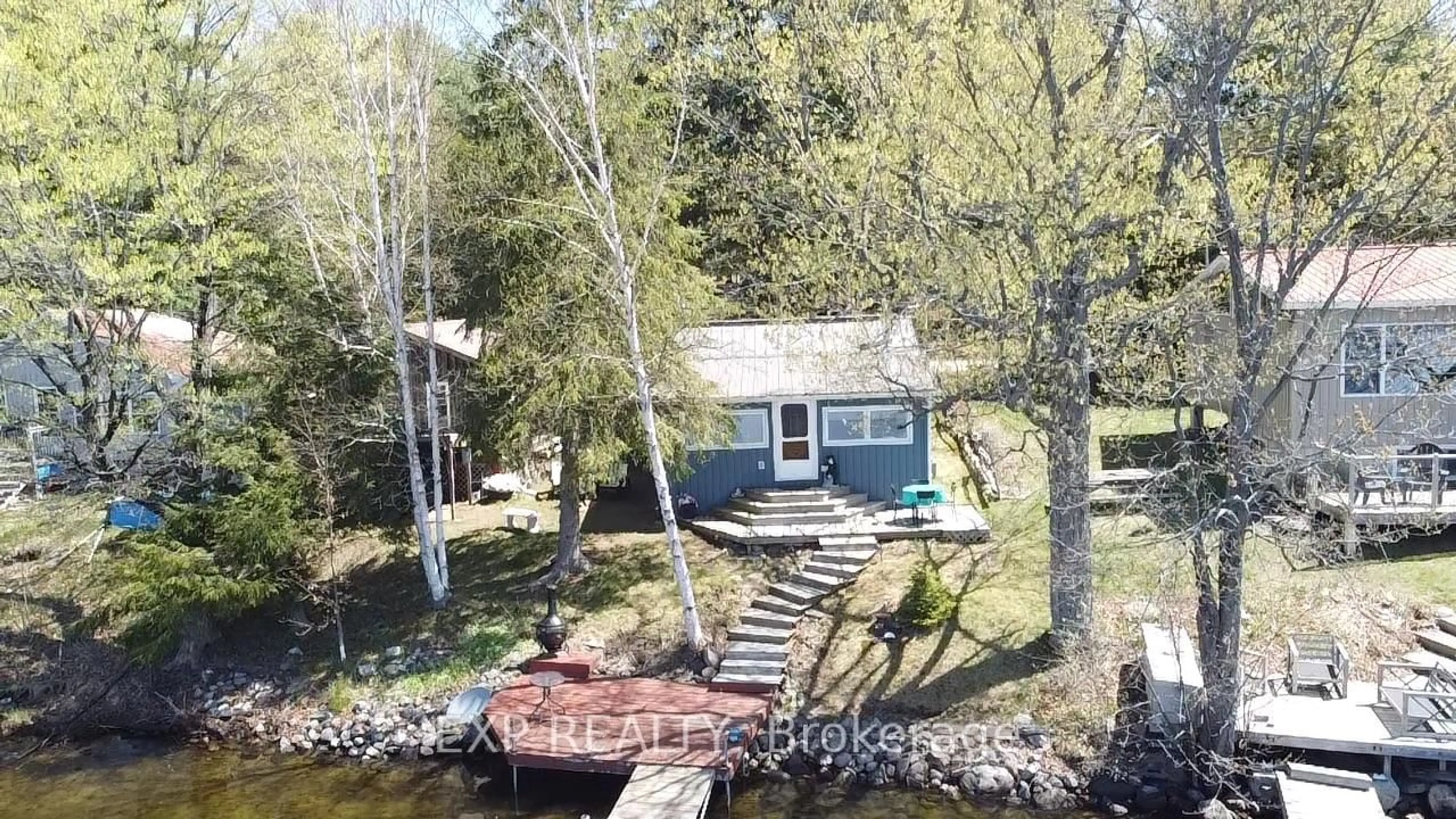 A pic from outside/outdoor area/front of a property/back of a property/a pic from drone, water/lake/river/ocean view for 118 Fraser Lake Rd, Boulter Ontario K0L 1G0