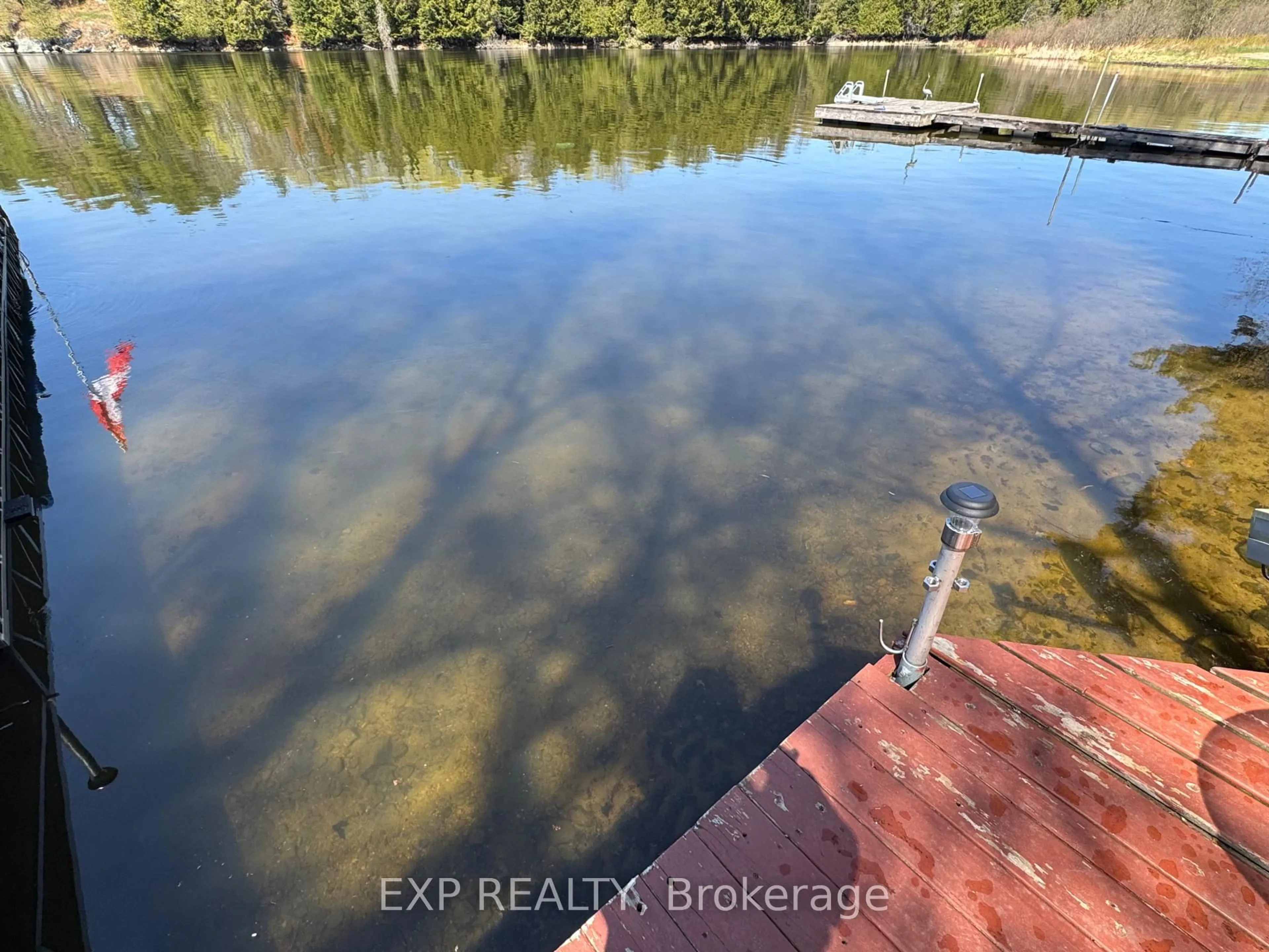 A pic from outside/outdoor area/front of a property/back of a property/a pic from drone, water/lake/river/ocean view for 118 Fraser Lake Rd, Boulter Ontario K0L 1G0