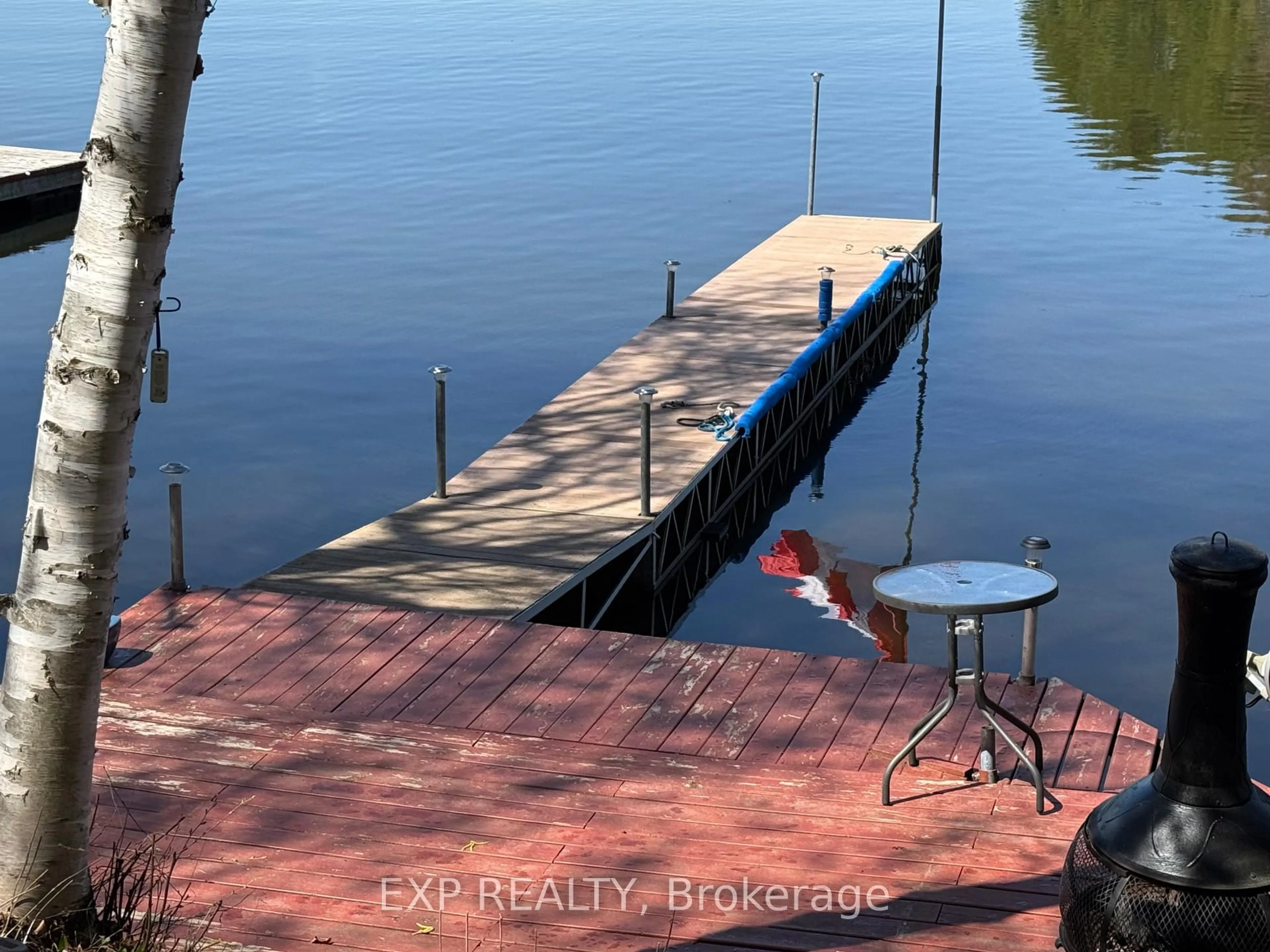 A pic from outside/outdoor area/front of a property/back of a property/a pic from drone, water/lake/river/ocean view for 118 Fraser Lake Rd, Boulter Ontario K0L 1G0