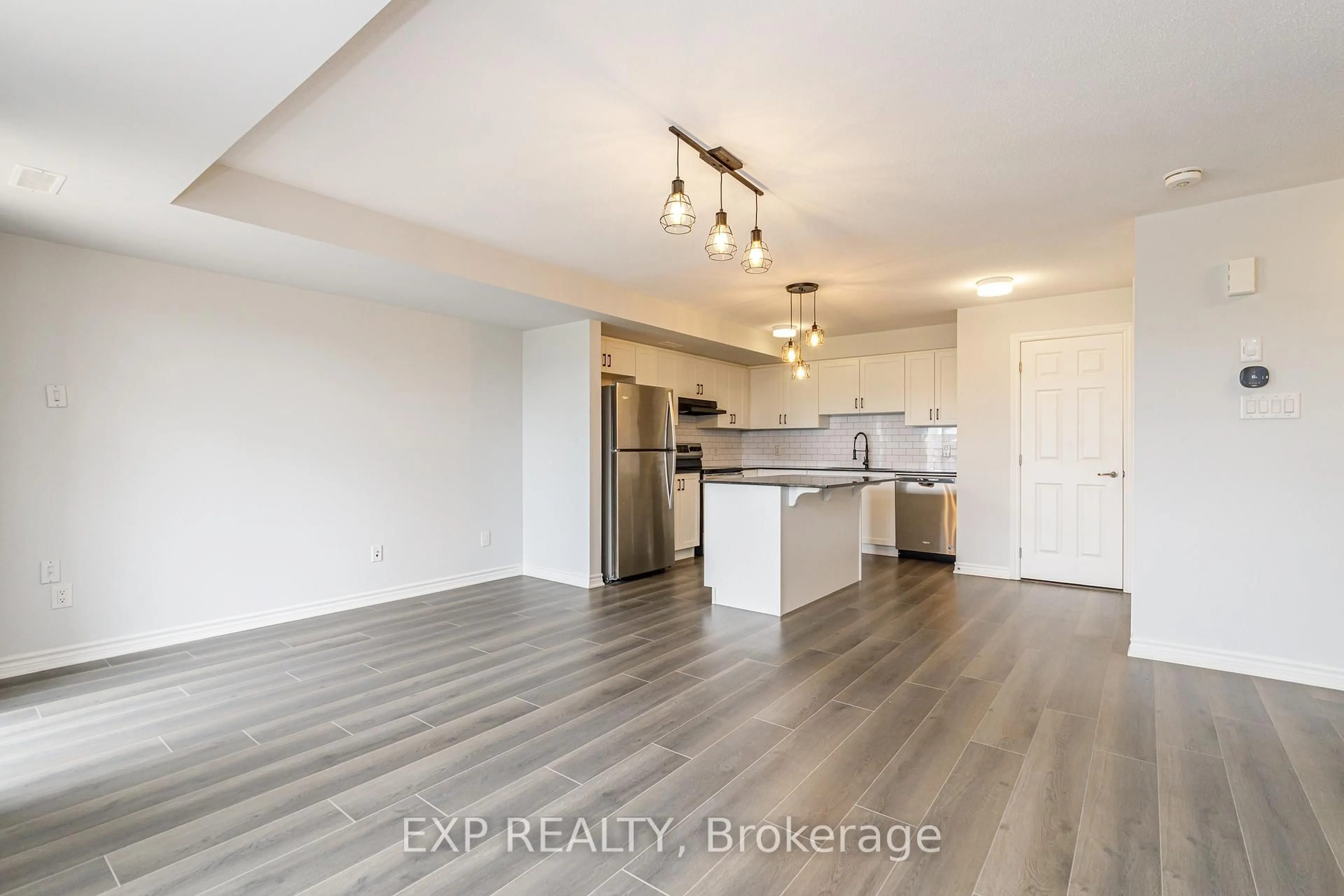 Open concept kitchen, wood/laminate floor for 852 Atlas Terr, Ottawa Ontario K2V 0S3
