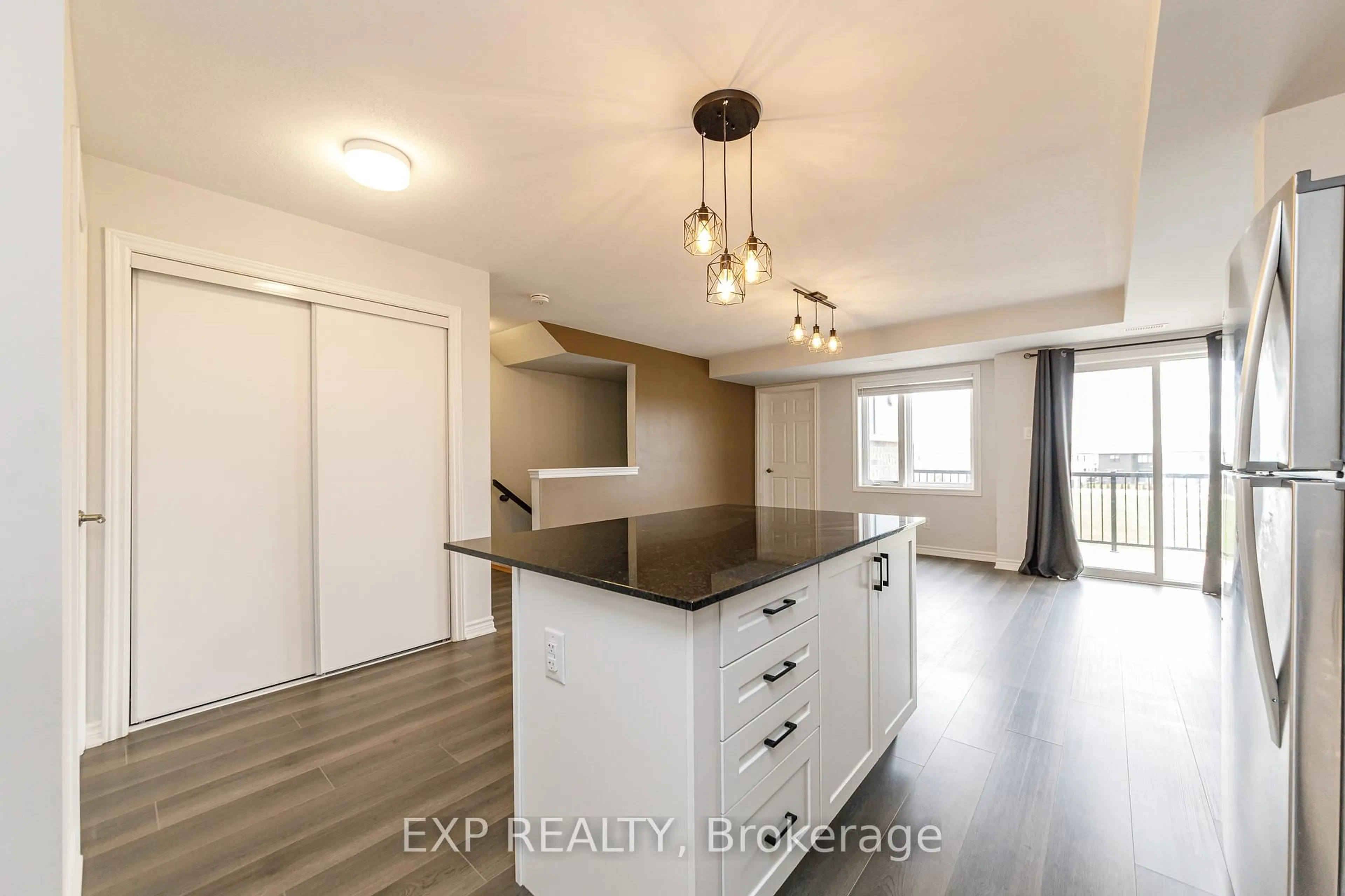 Open concept kitchen, wood/laminate floor for 852 Atlas Terr, Ottawa Ontario K2V 0S3