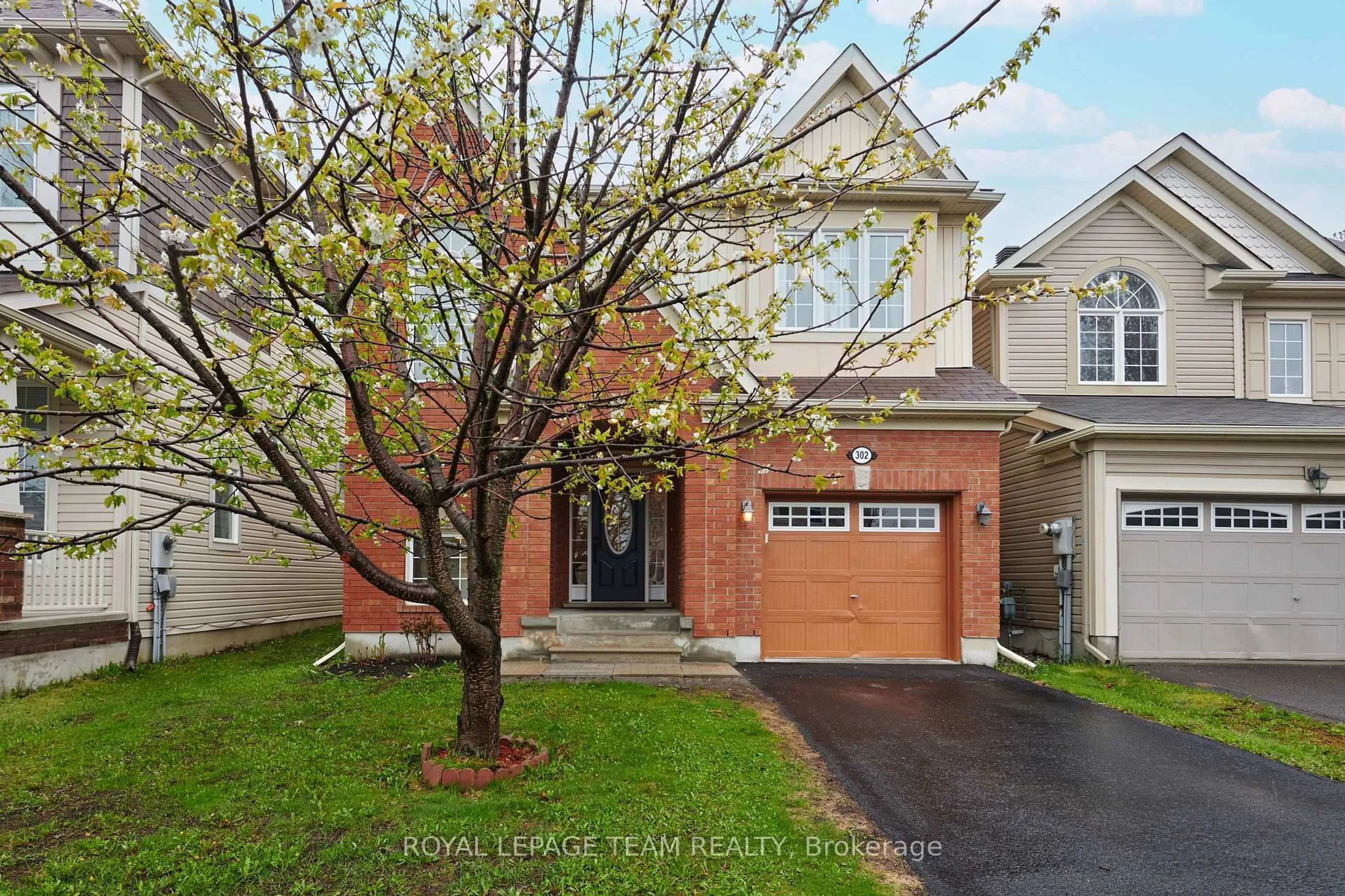 Home with brick exterior material, street for 302 River Landing Ave, Ottawa Ontario K2J 3V4