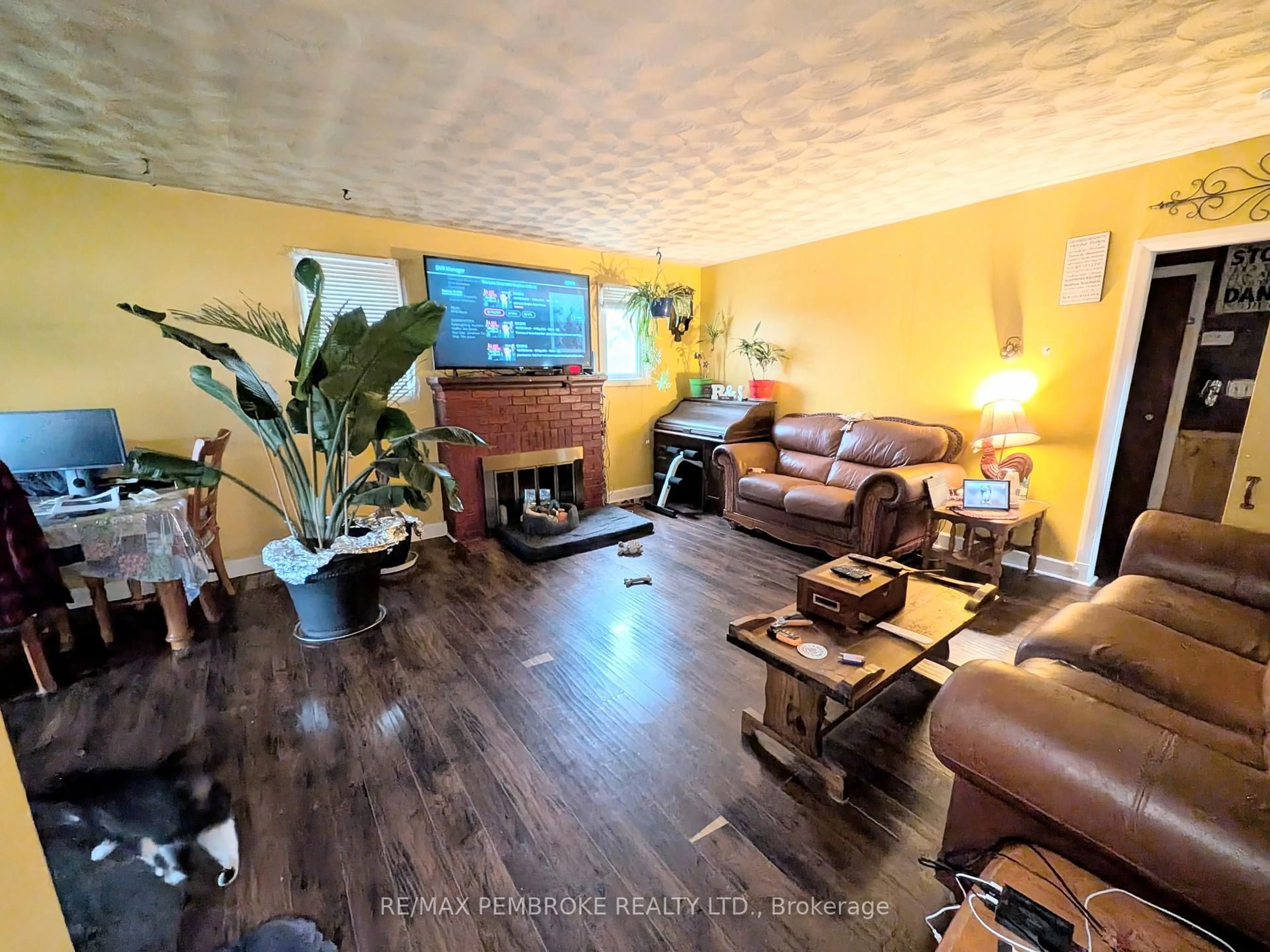 Living room with furniture, wood/laminate floor for 12 Doran Rd, Petawawa Ontario K8H 1P5