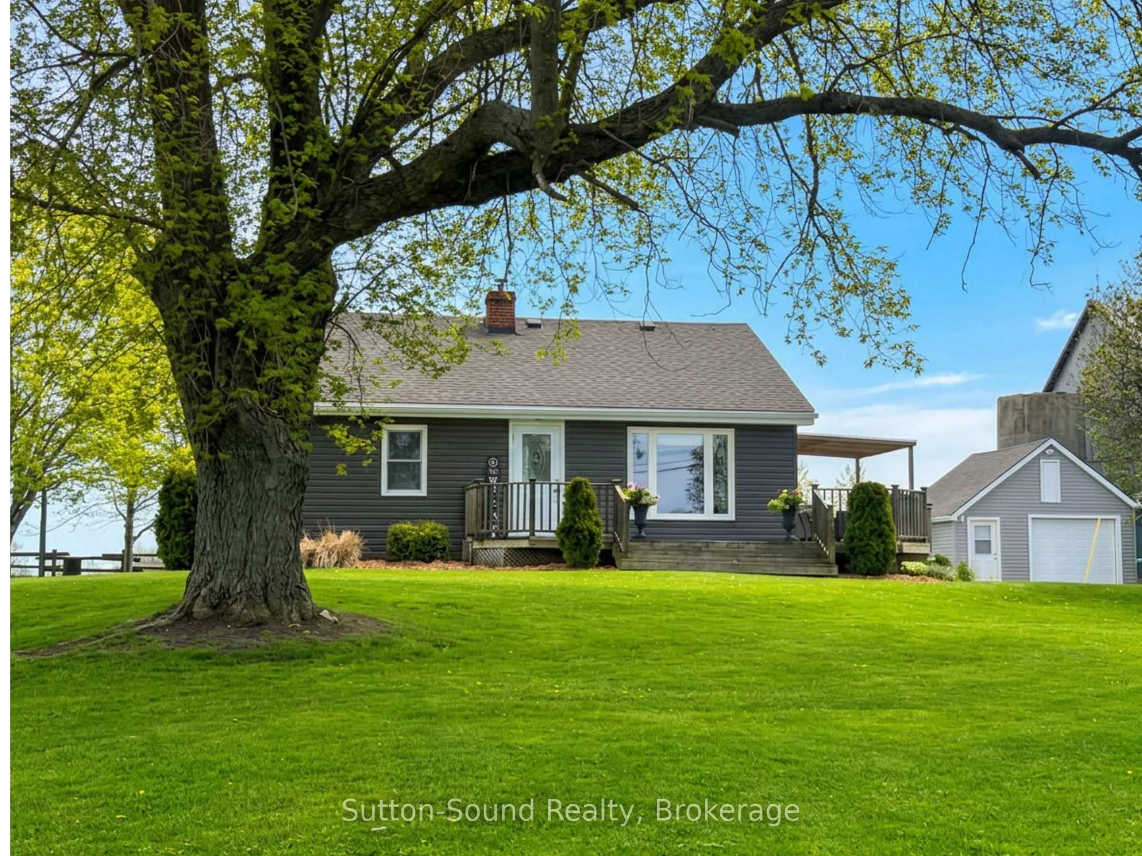 Home with vinyl exterior material, street for 018389 Bruce Road 10, Georgian Bluffs Ontario N0H 1A0