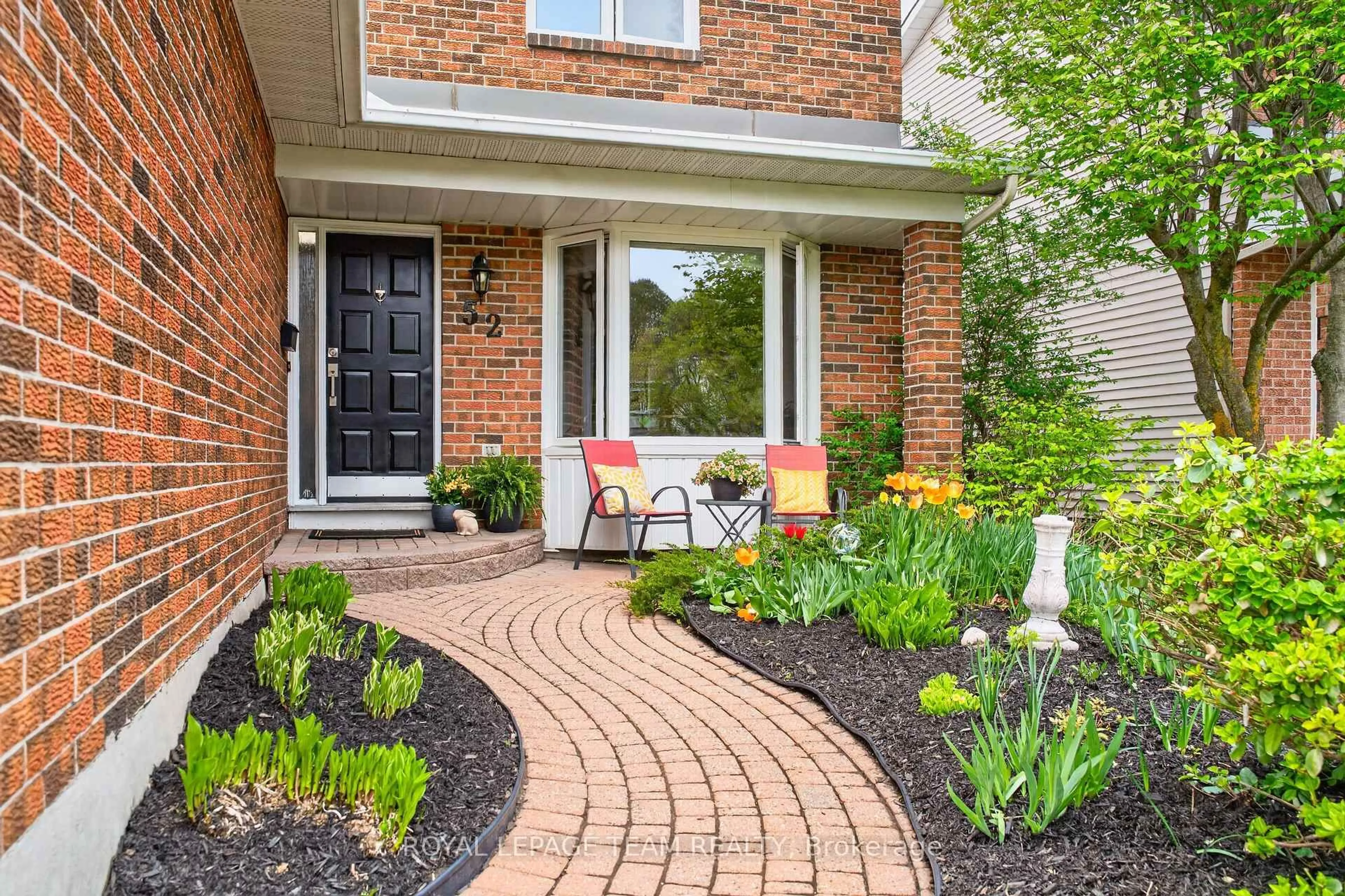 Home with brick exterior material, street for 52 Drainie Dr, Kanata Ontario K2L 3J9