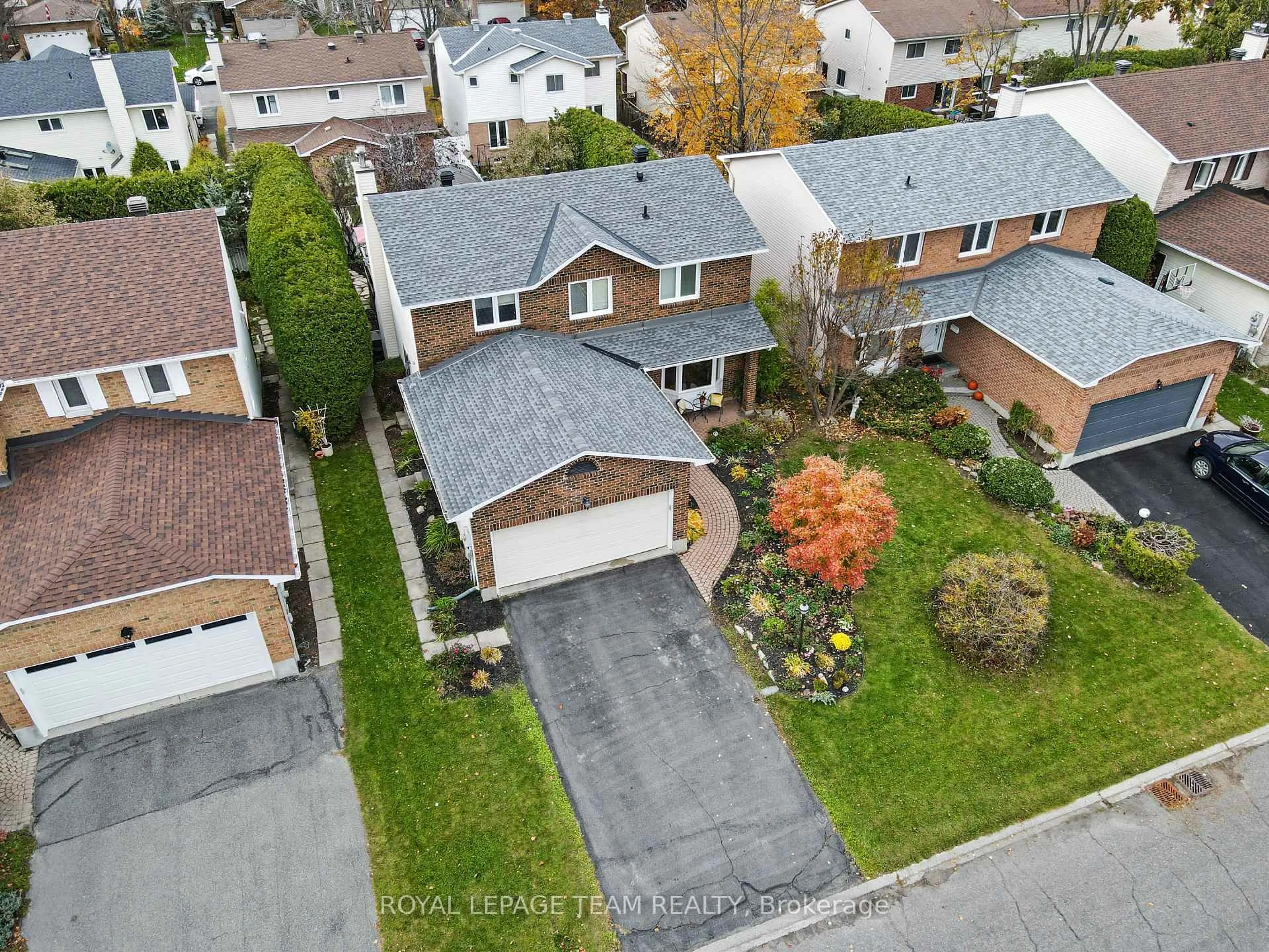 A pic from outside/outdoor area/front of a property/back of a property/a pic from drone, street for 52 Drainie Dr, Kanata Ontario K2L 3J9