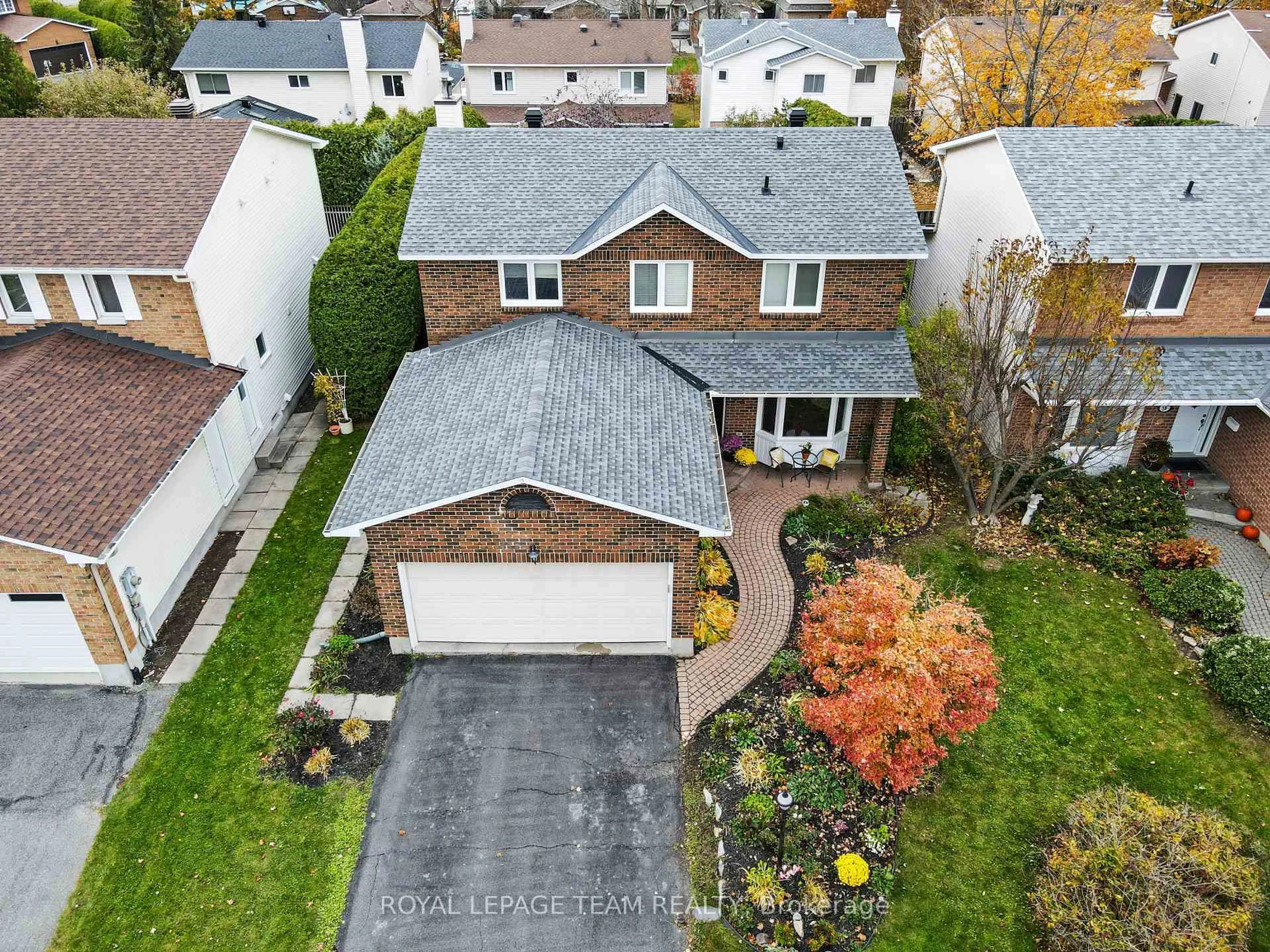A pic from outside/outdoor area/front of a property/back of a property/a pic from drone, street for 52 Drainie Dr, Kanata Ontario K2L 3J9
