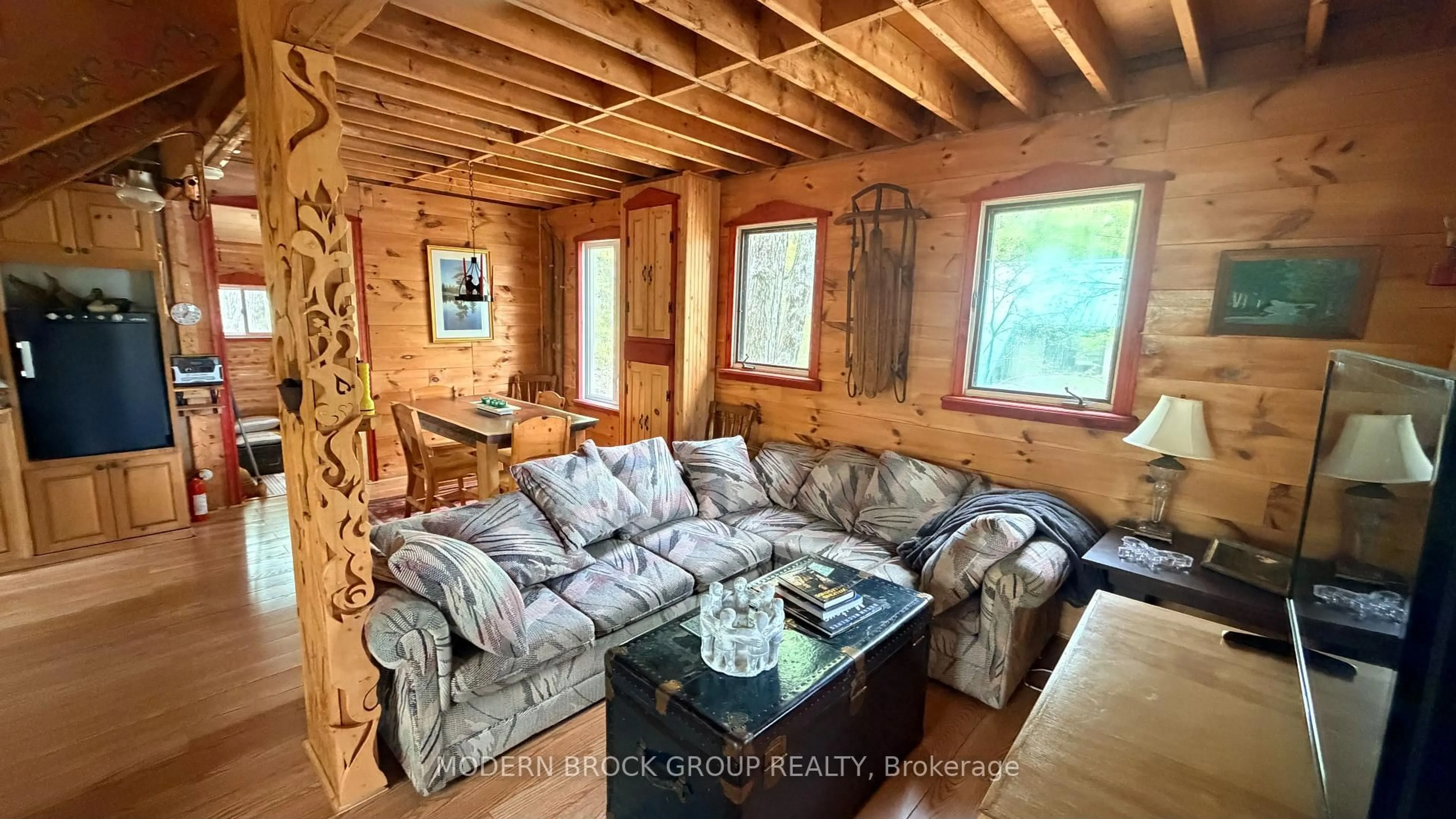 Living room with furniture, wood/laminate floor for 7026 Black Jack Island, Rideau Lakes Ontario K0E 1G0