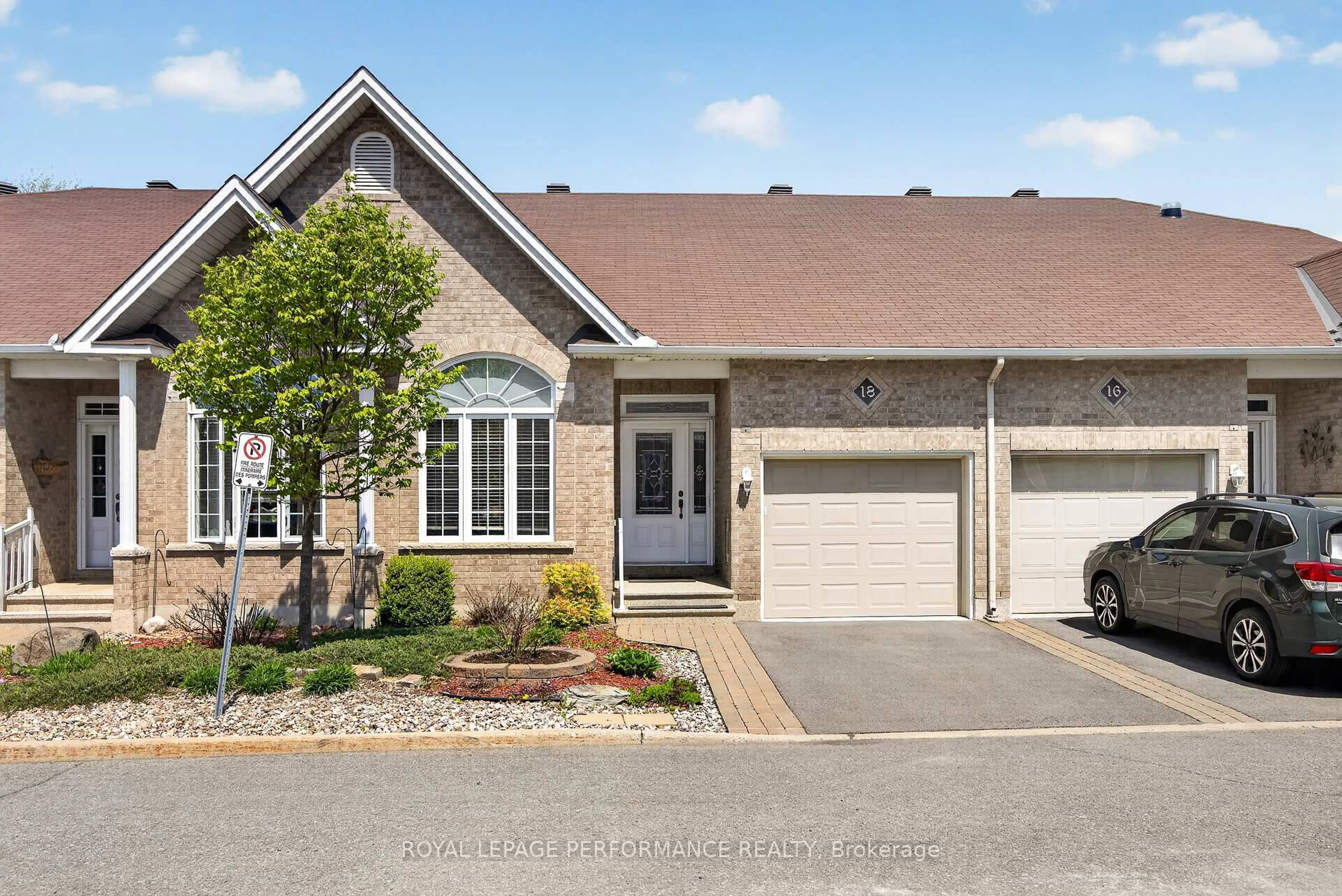 Home with brick exterior material, street for 18 Chapelier Private, Orleans Ontario K1E 3Y1