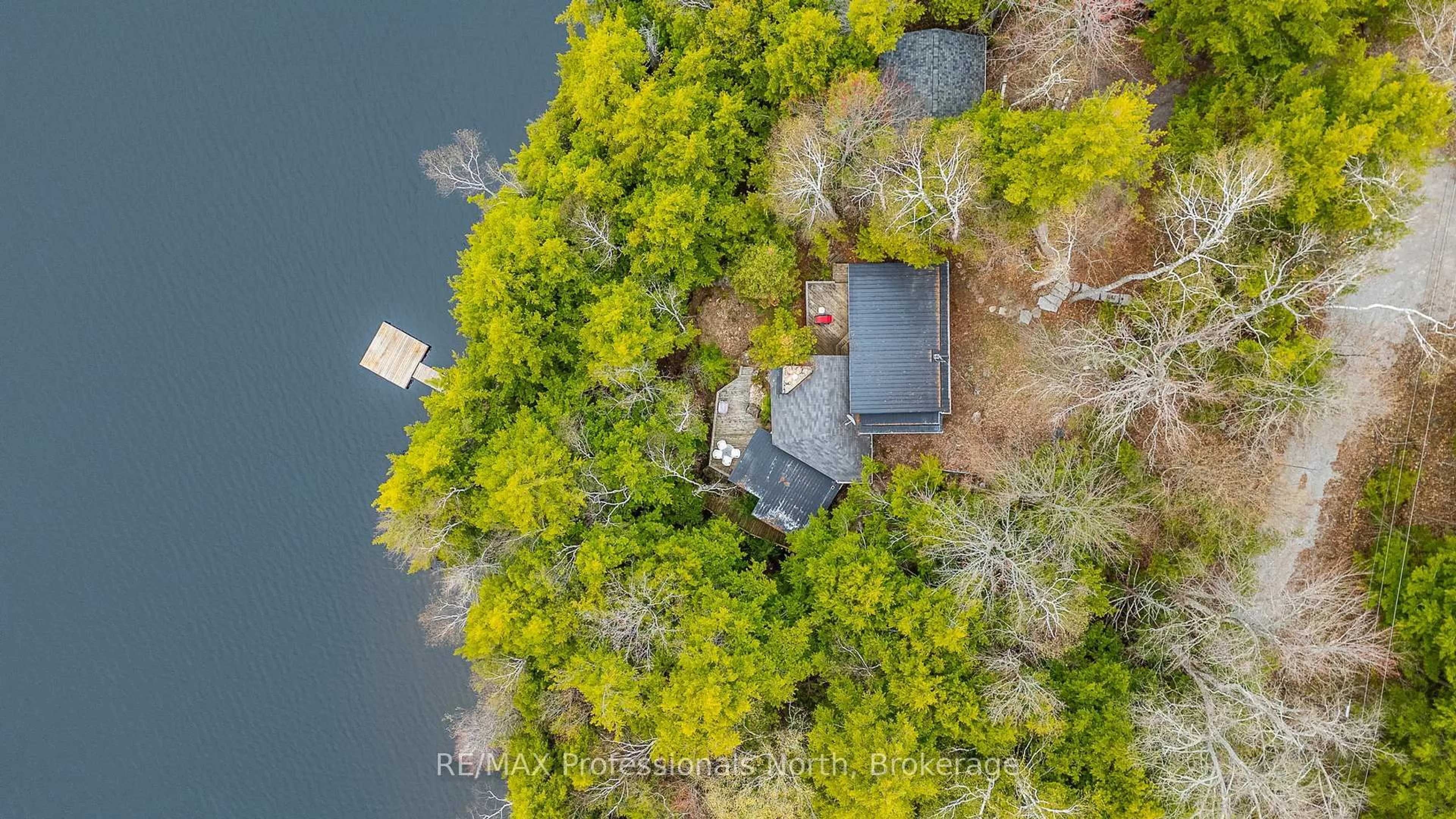 A pic from outside/outdoor area/front of a property/back of a property/a pic from drone, water/lake/river/ocean view for 1201 Trellis Tr, Minden Hills Ontario K0M 2K0