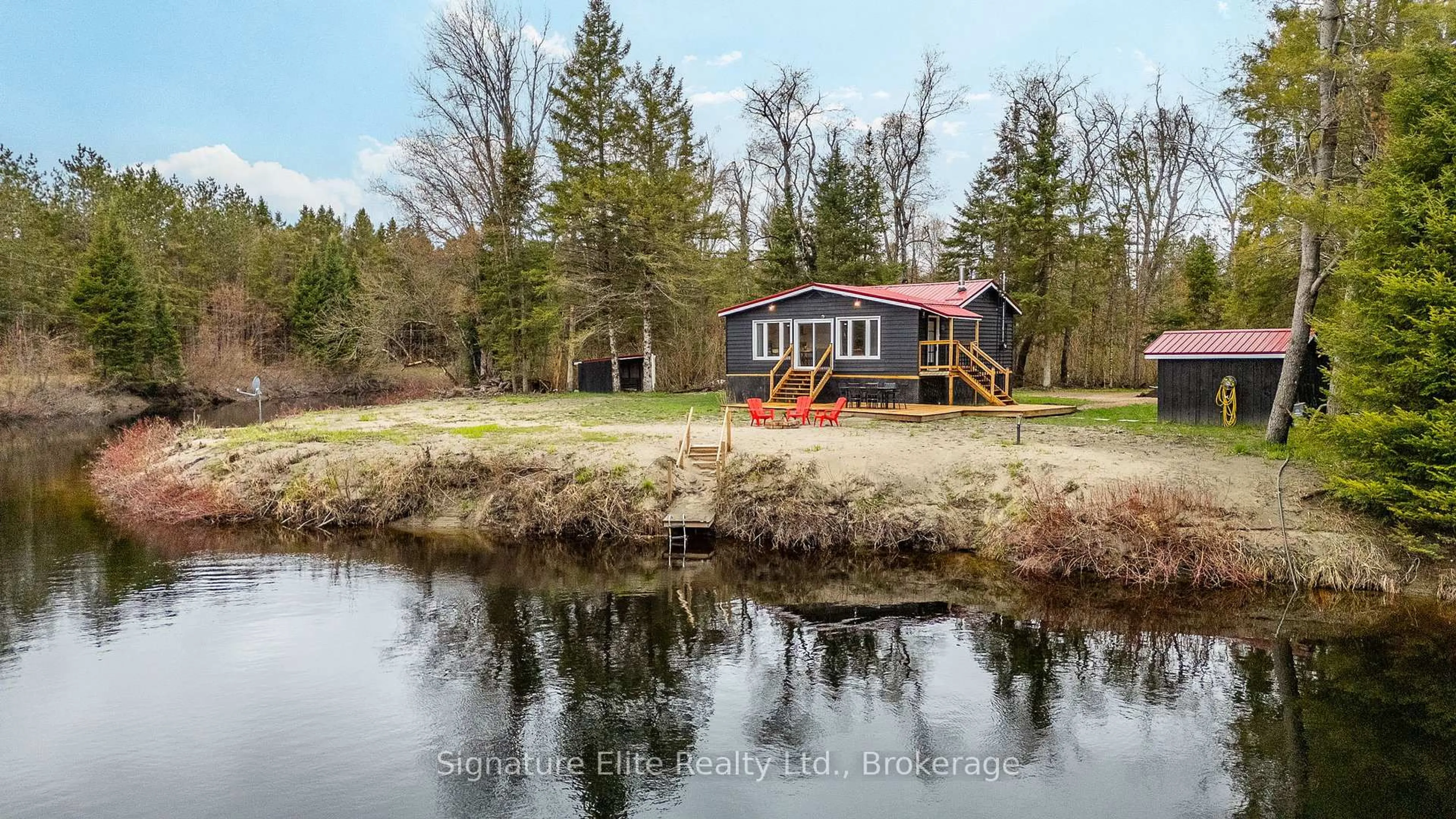 A pic from outside/outdoor area/front of a property/back of a property/a pic from drone, water/lake/river/ocean view for 1077 Nystedt Lane, Minden Hills Ontario K0M 2A1