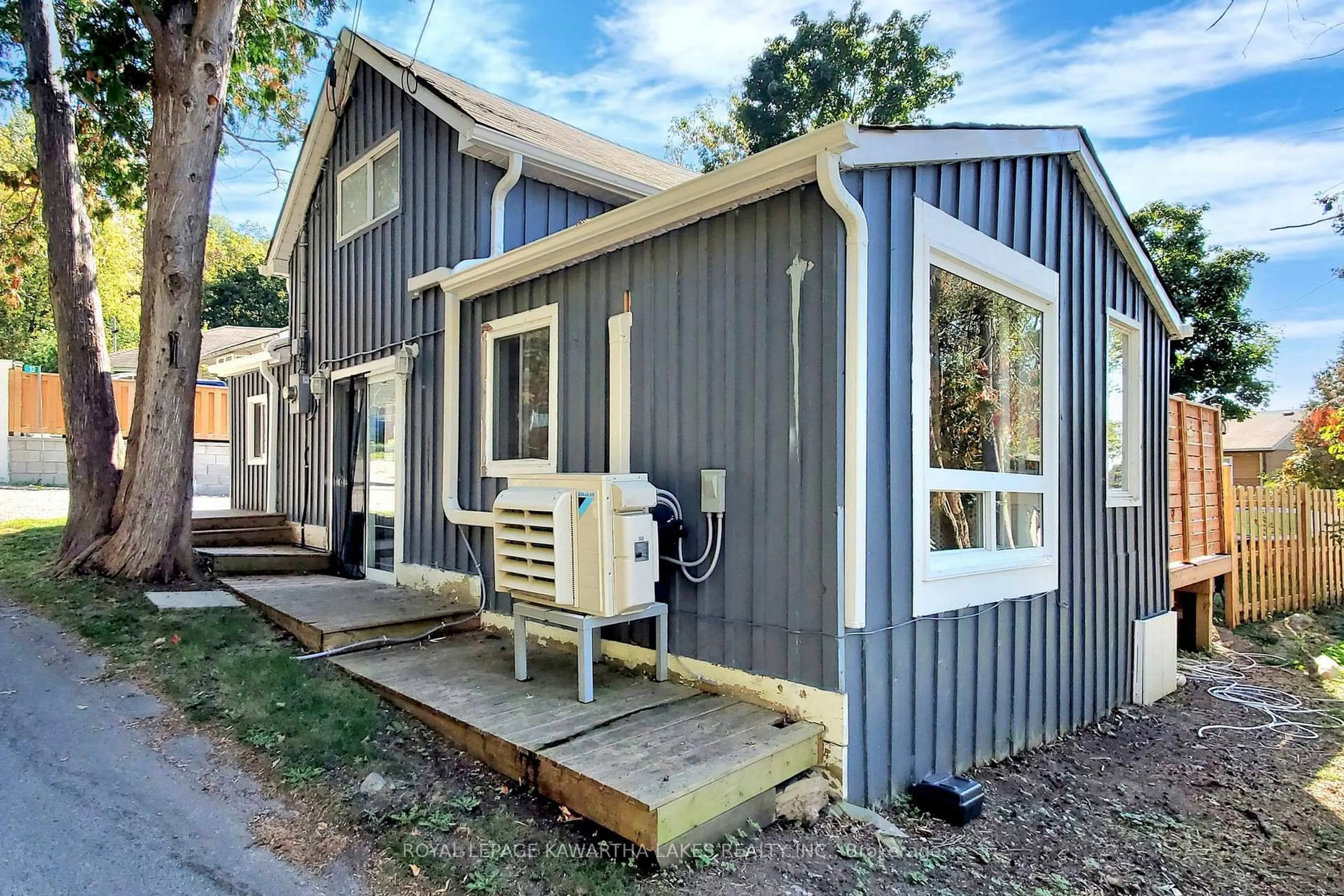 Home with vinyl exterior material, street for 12 Birchcliff Ave, Kawartha Lakes Ontario K0M 1L0