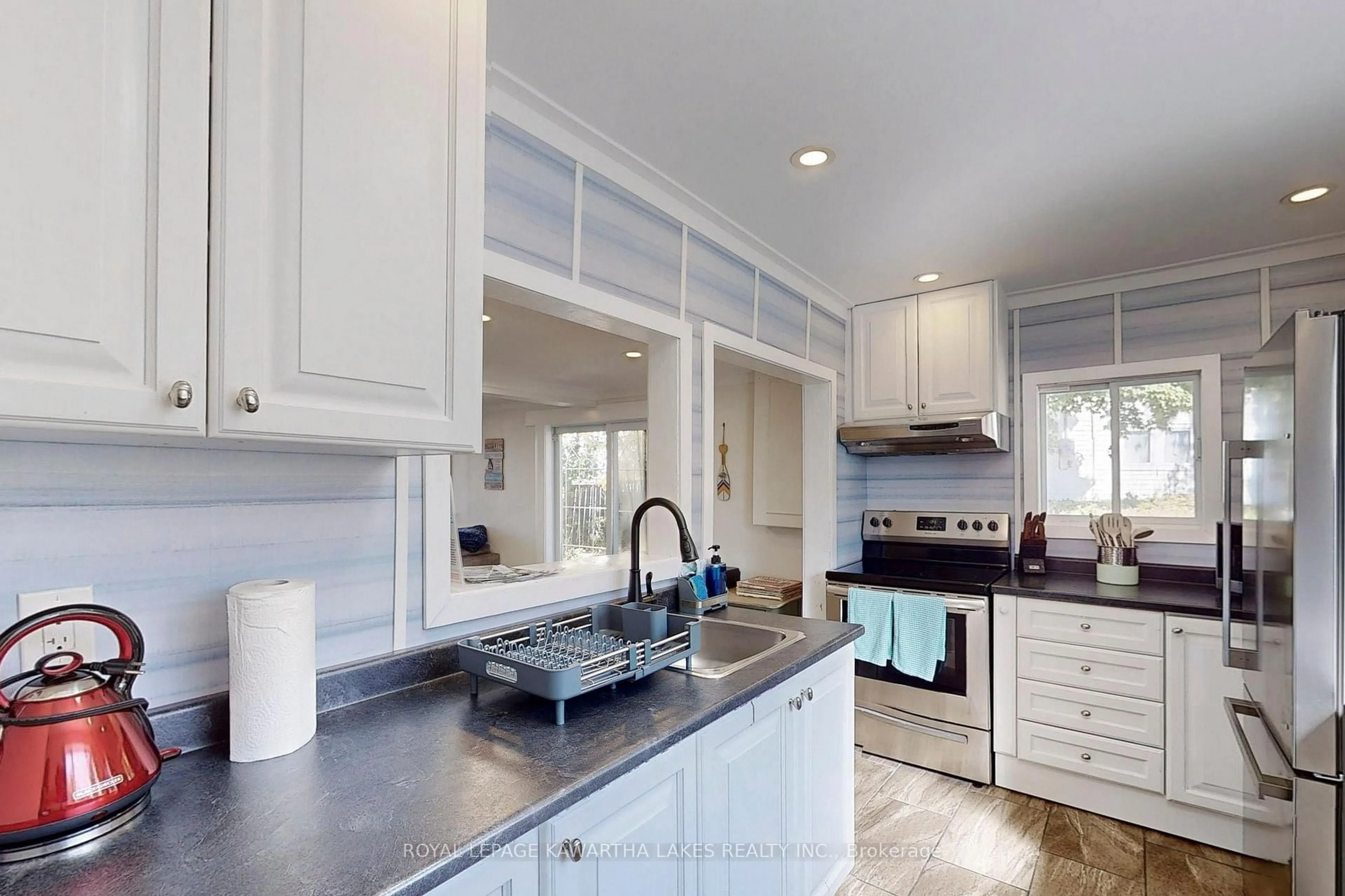 Open concept kitchen, ceramic/tile floor for 12 Birchcliff Ave, Kawartha Lakes Ontario K0M 1L0