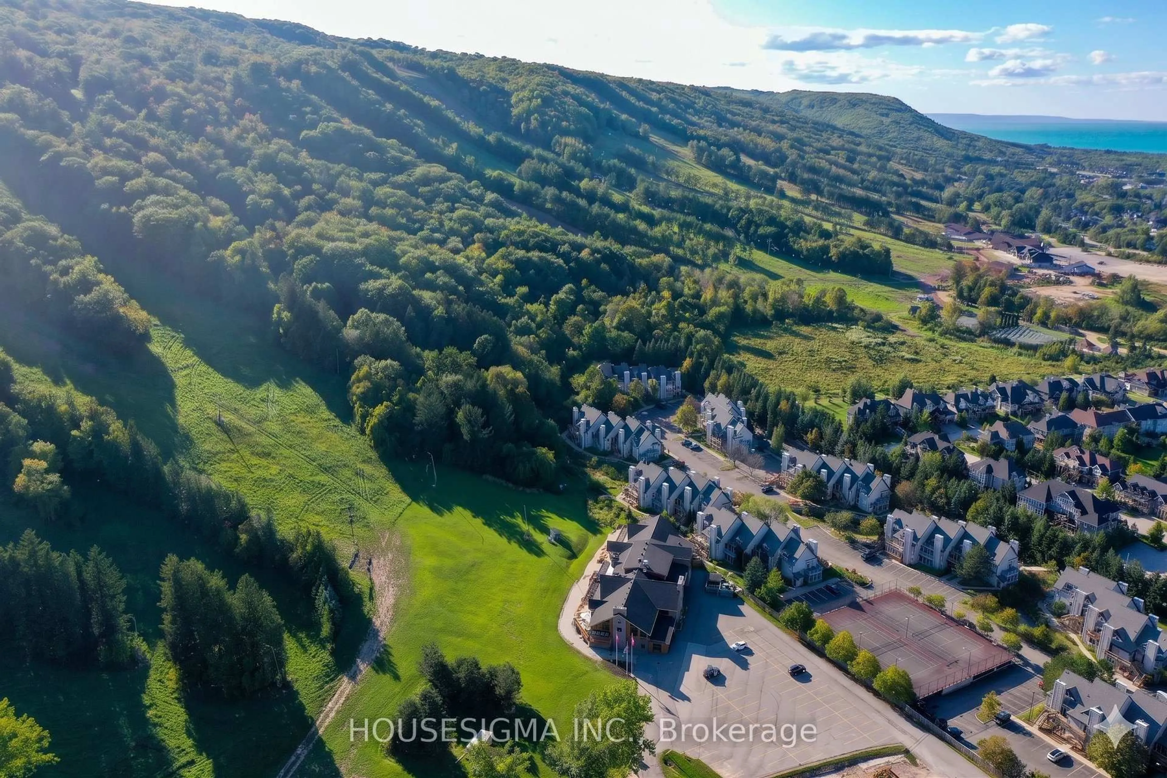 A pic from outside/outdoor area/front of a property/back of a property/a pic from drone, mountain view for 796468 Grey 19 Rd #407, Blue Mountains Ontario L9Y 0N6