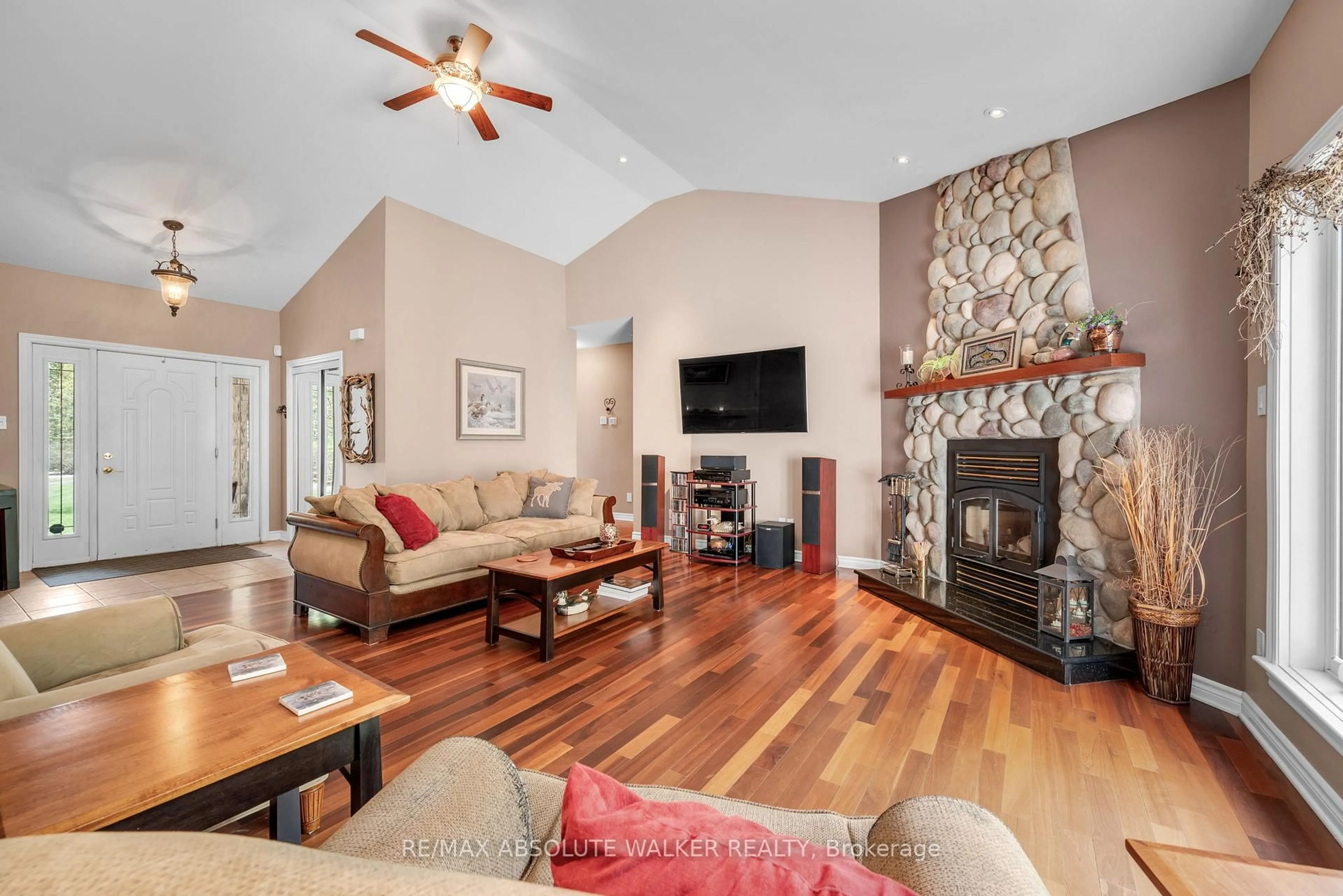 Living room with furniture, wood/laminate floor for 114 Hardwood Dr, Kinburn Ontario K0A 2H0