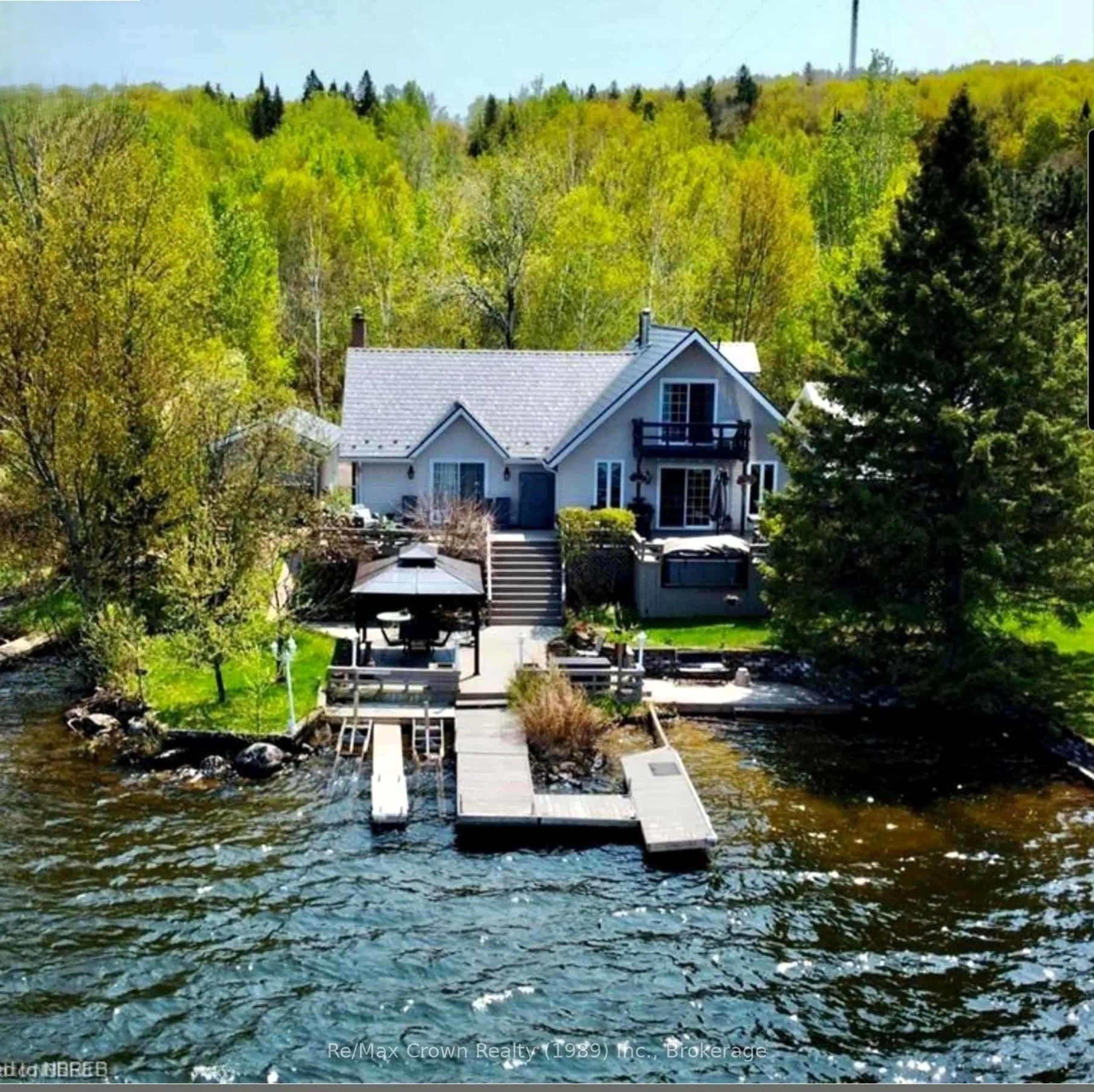A pic from outside/outdoor area/front of a property/back of a property/a pic from drone, water/lake/river/ocean view for 38 Turgeon Lane, East Ferris Ontario P0H 1B0