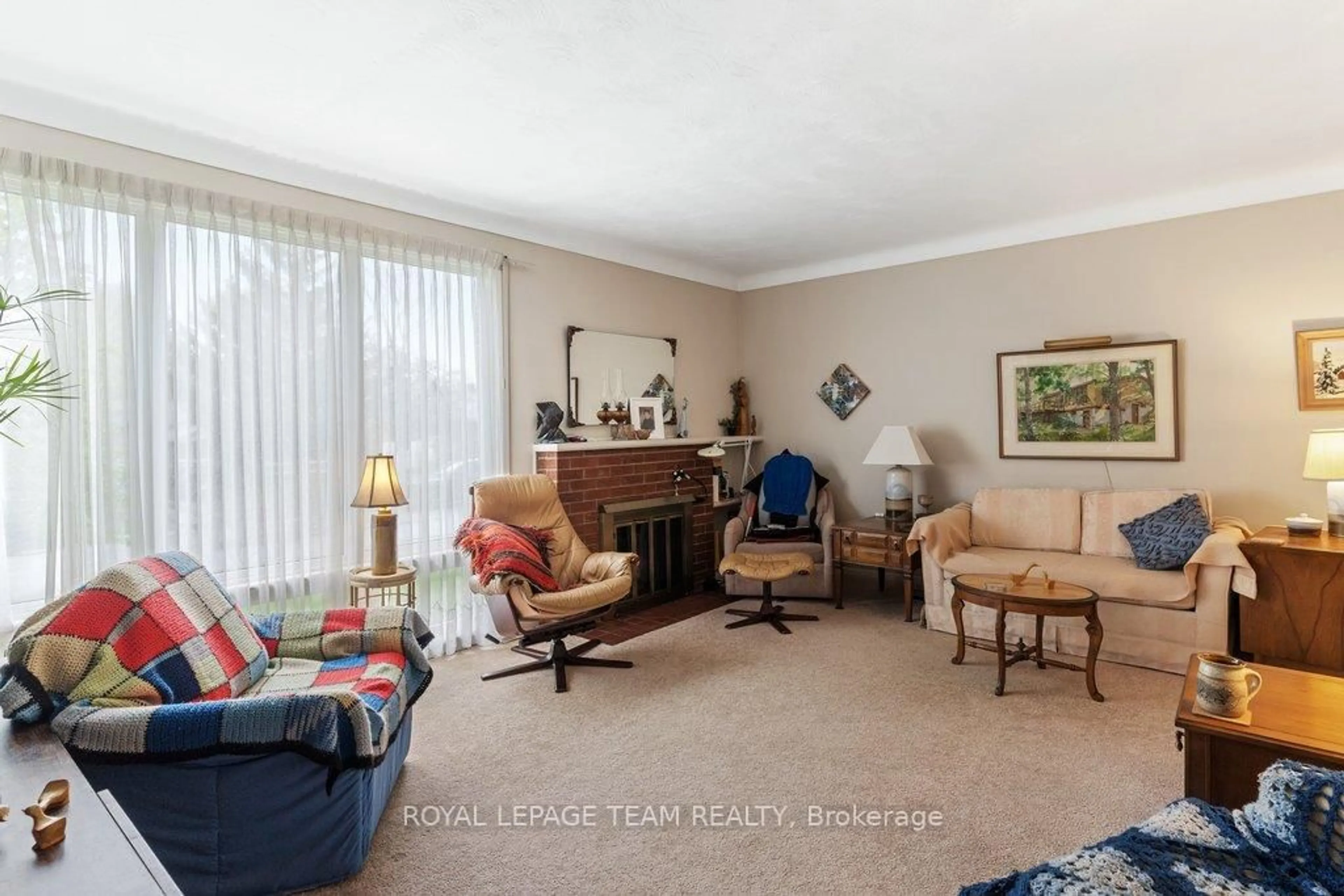 Living room with furniture, carpet floor for 684 Wavell Ave, Ottawa Ontario K2A 3B1